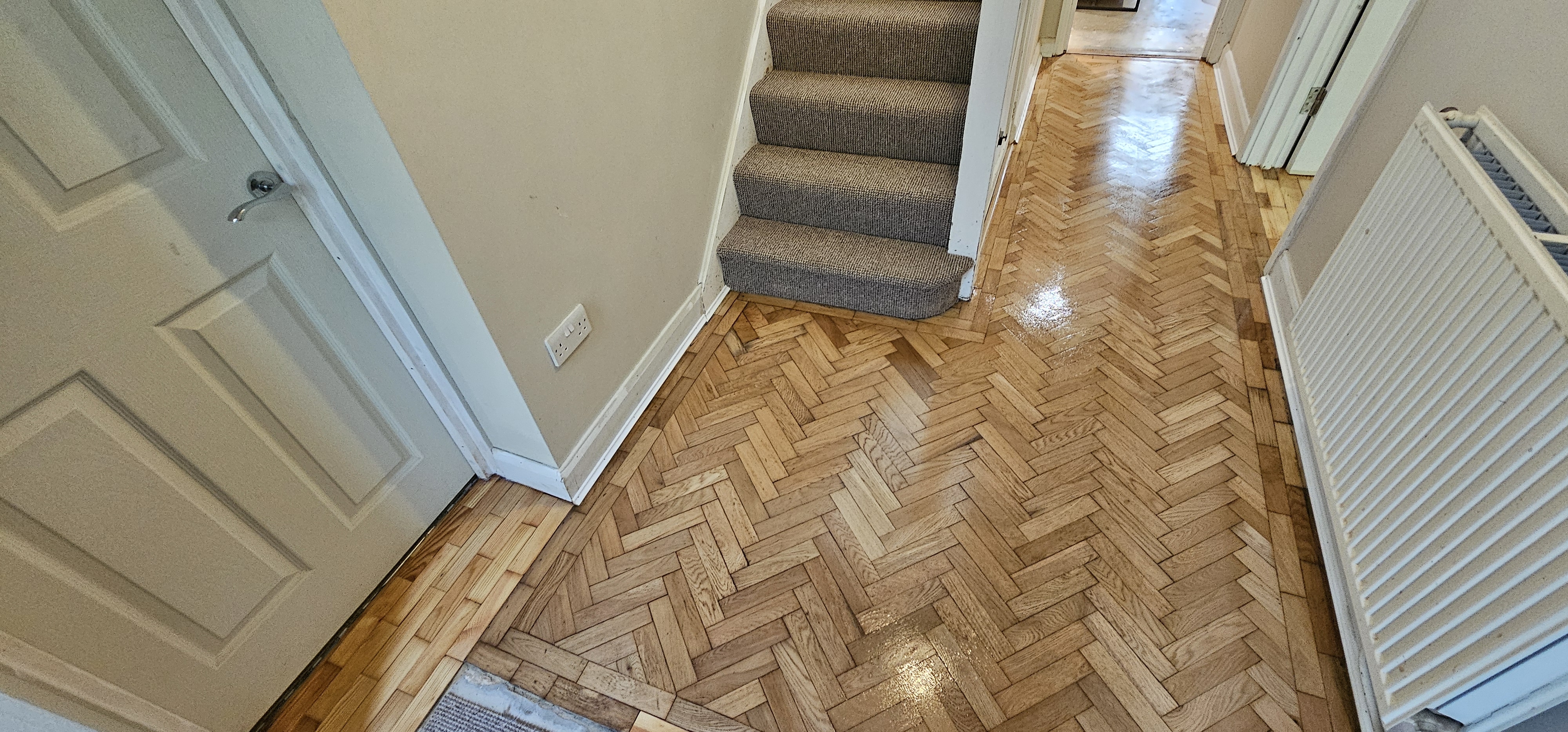 Parquet floor after sanding work in WD25