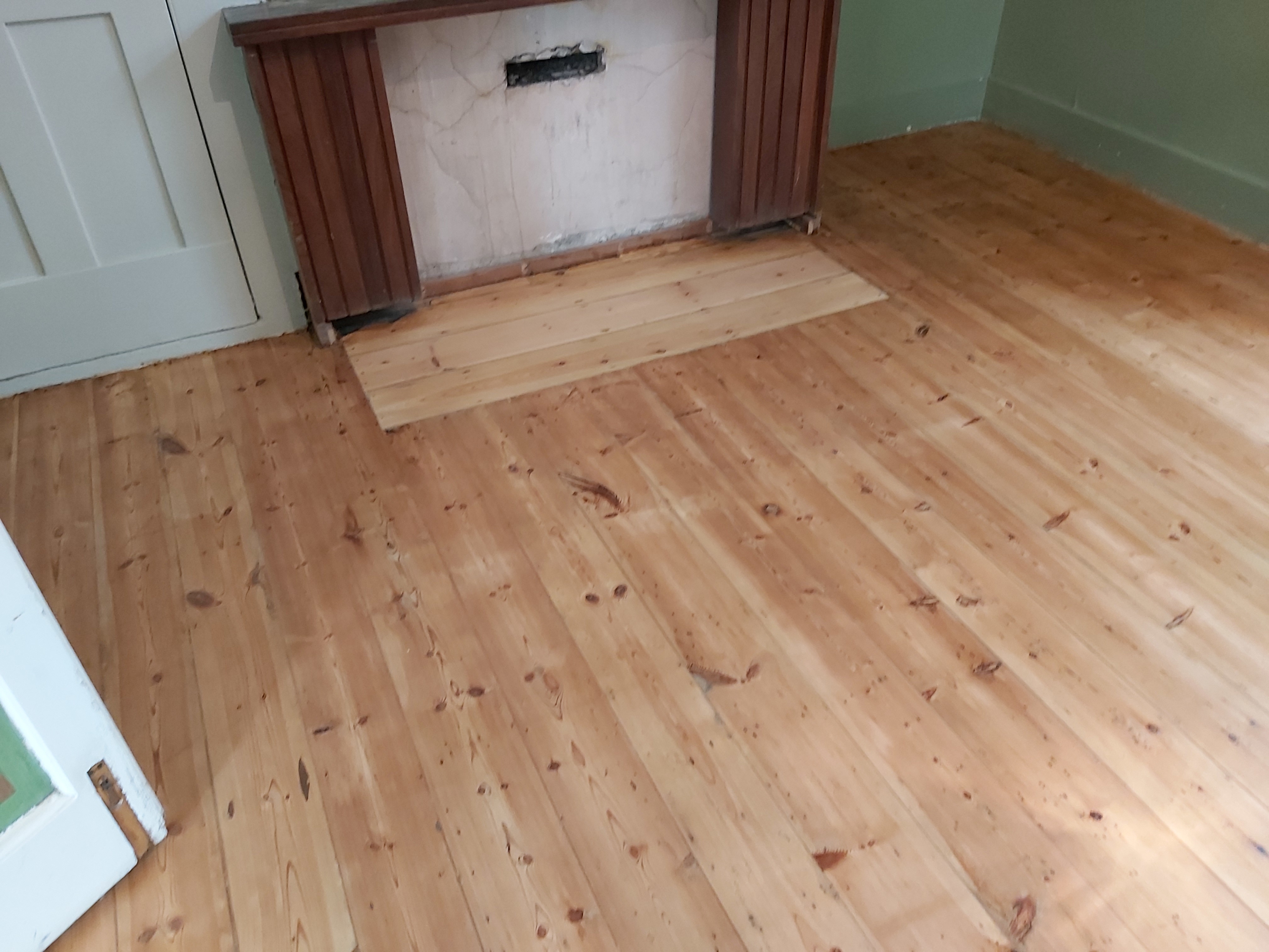 Hardwood floor after sanding work in E11
