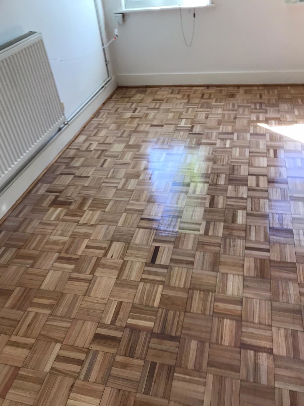 Parquet floor after sanding work in E17