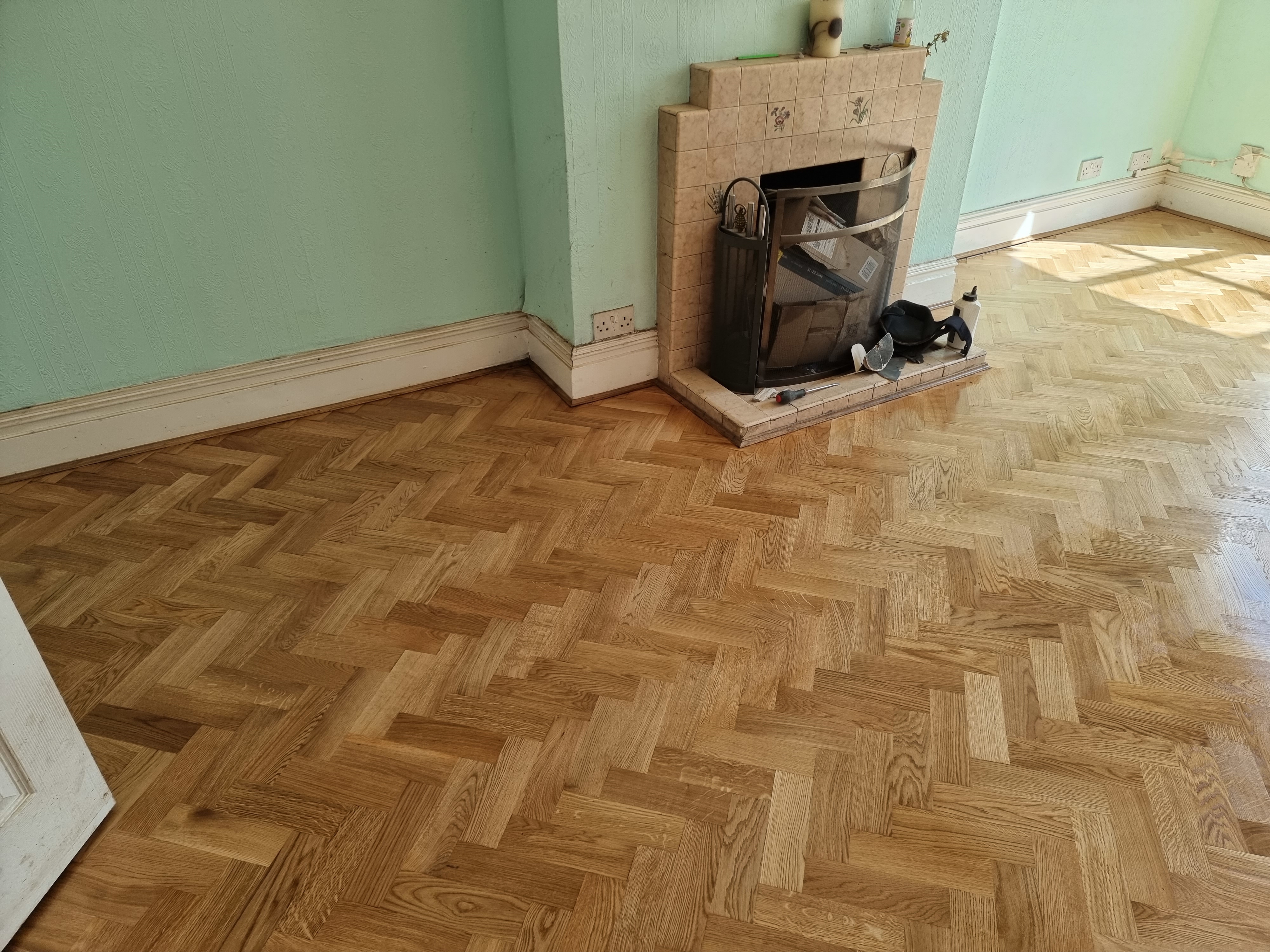 Hardwood floor after sanding work in HA0