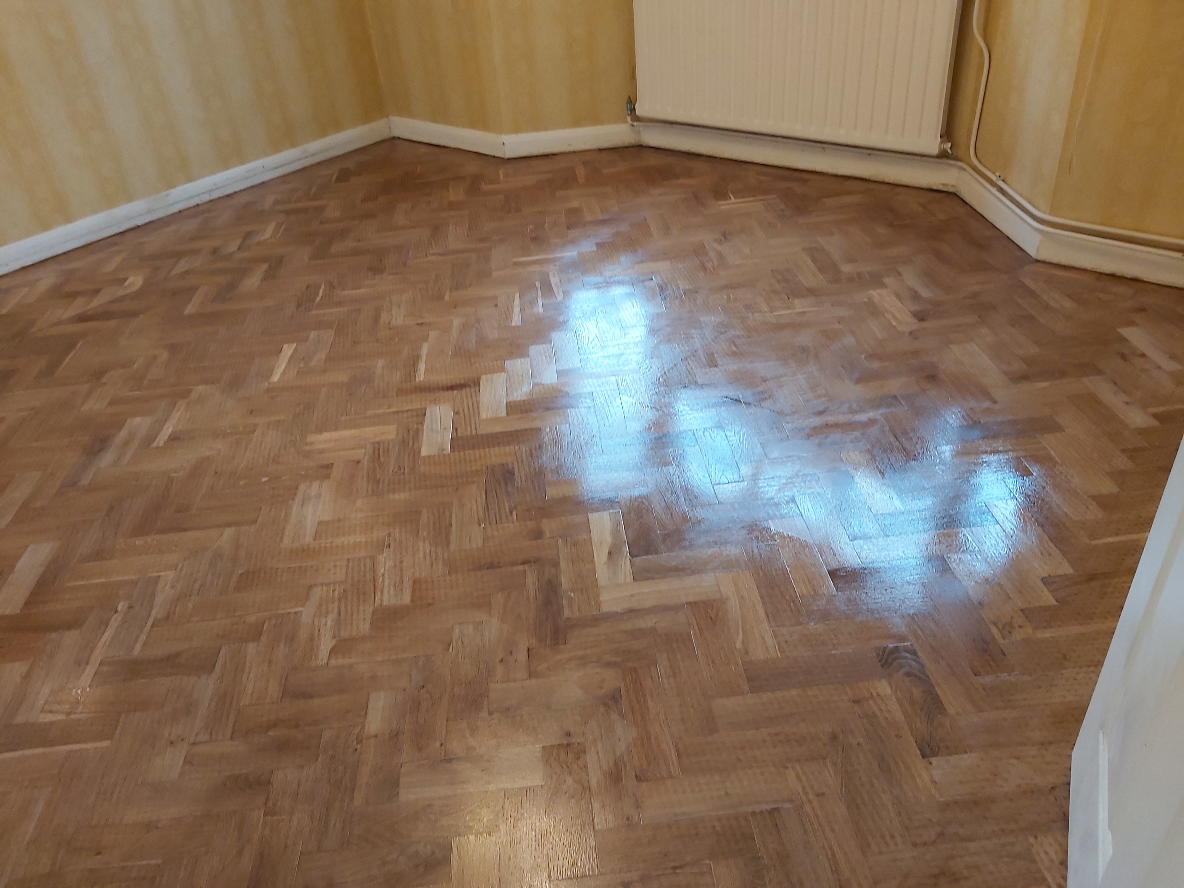 Parquet floor after sanding work in KT10