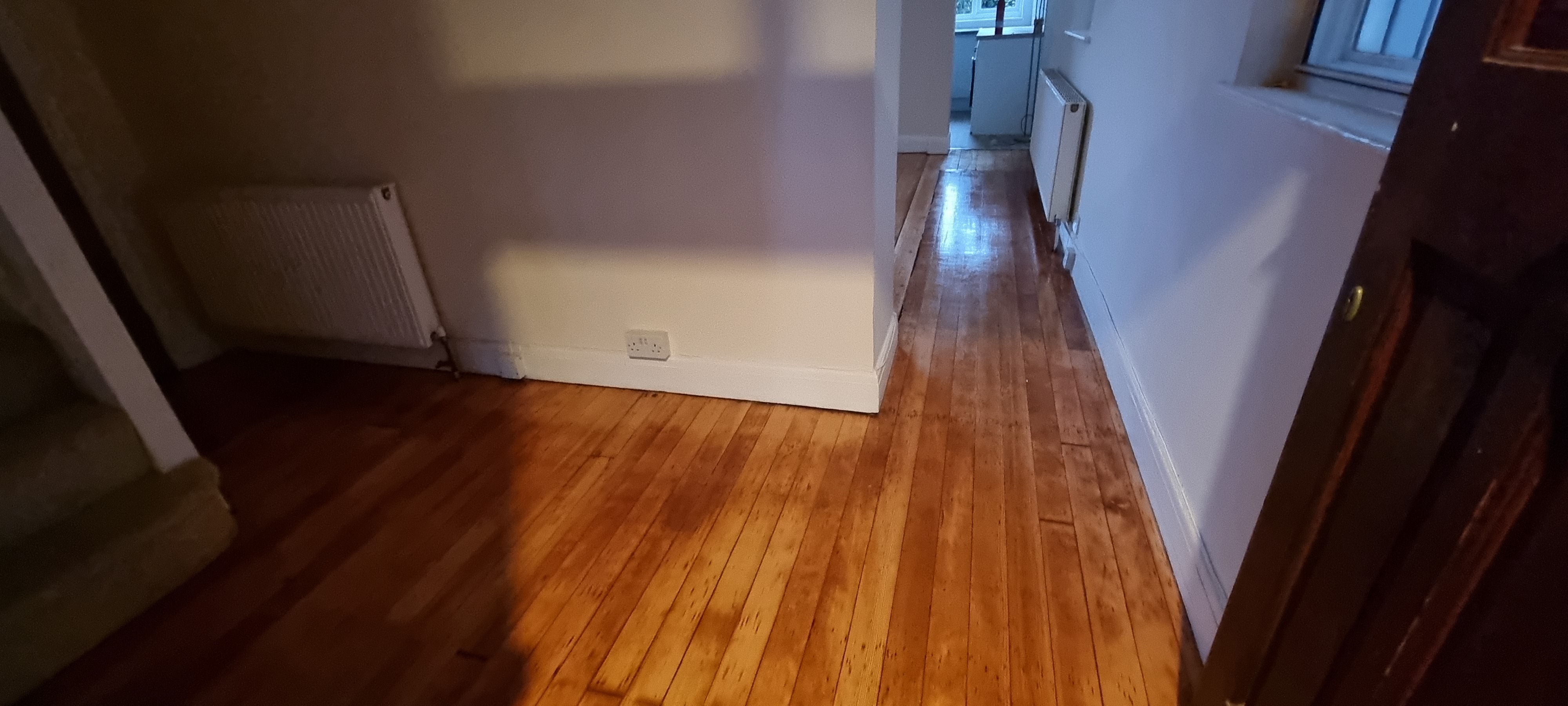 Floorboards floor after sanding work in KT2