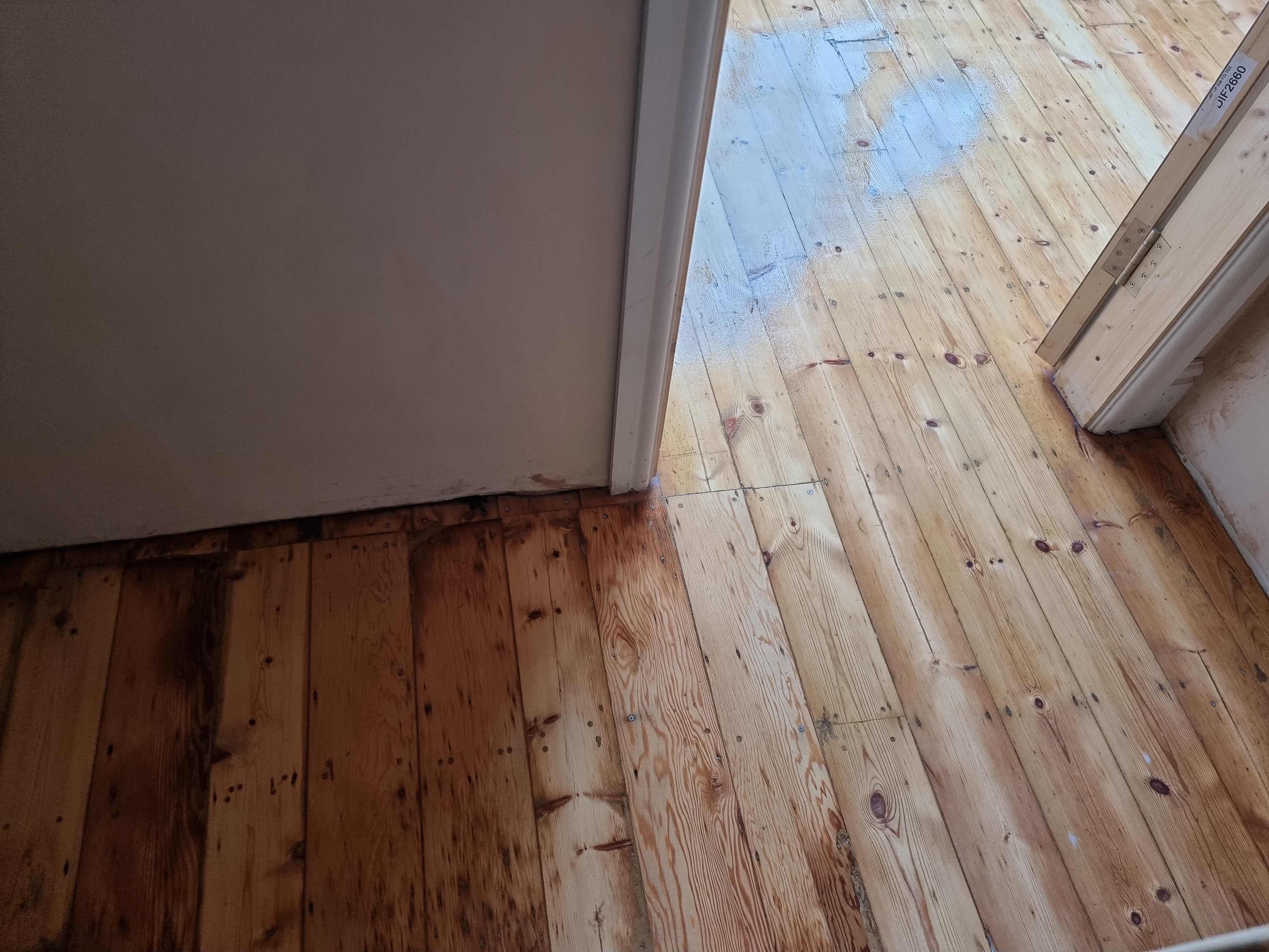 Floorboards floor after sanding work in KT6