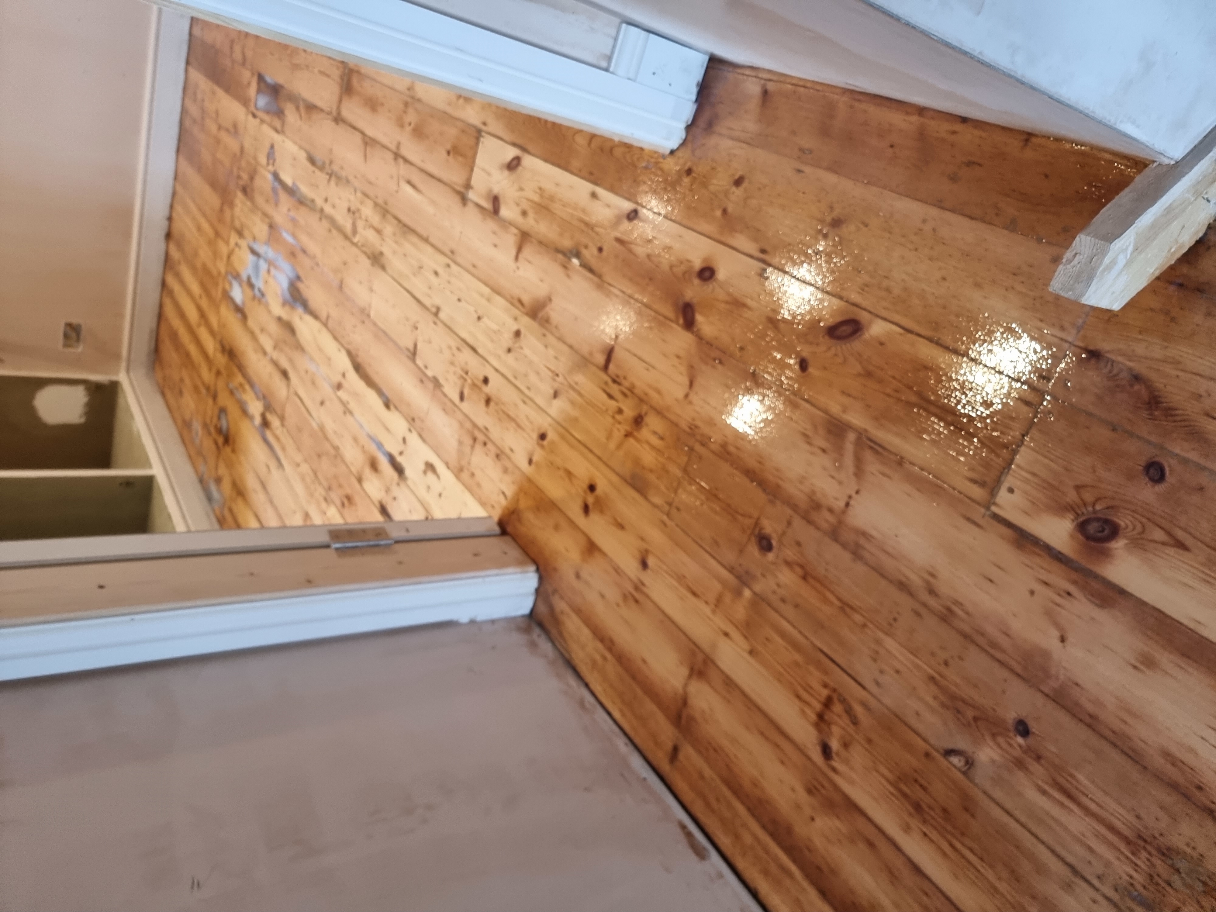 Floorboards floor after sanding work in KT6