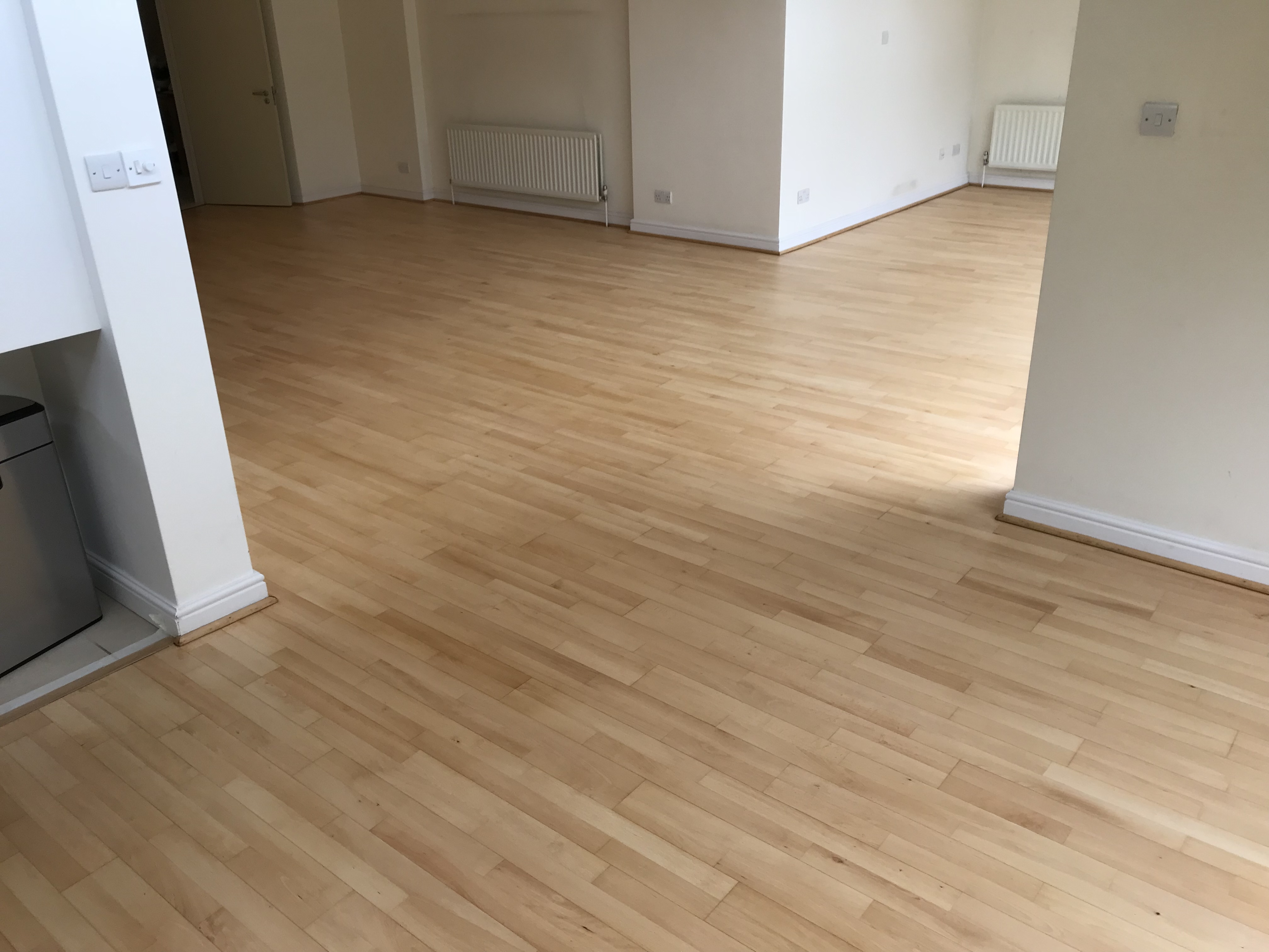 Hardwood floor after sanding work in N6