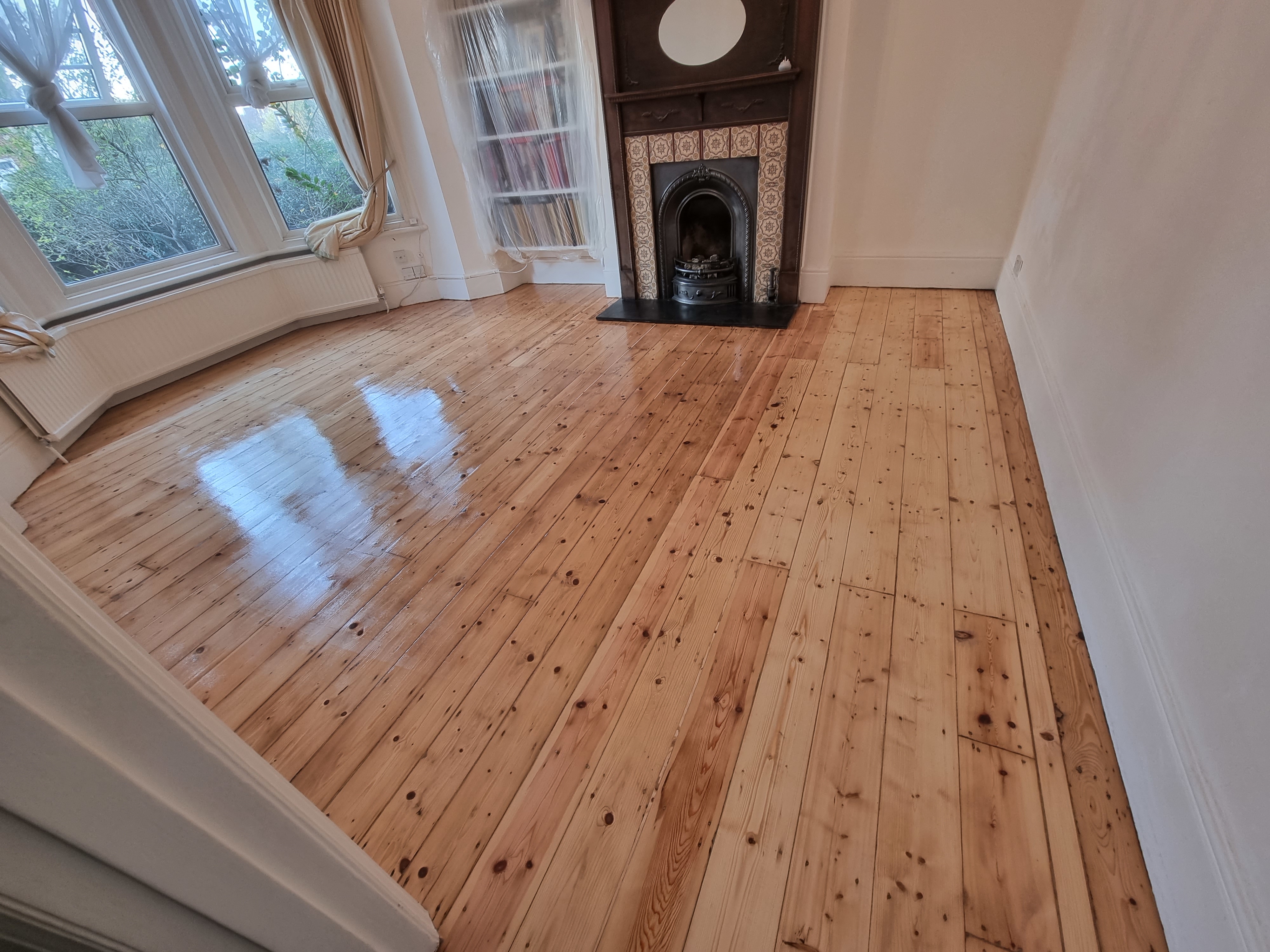 Floorboards floor after sanding work in NW10
