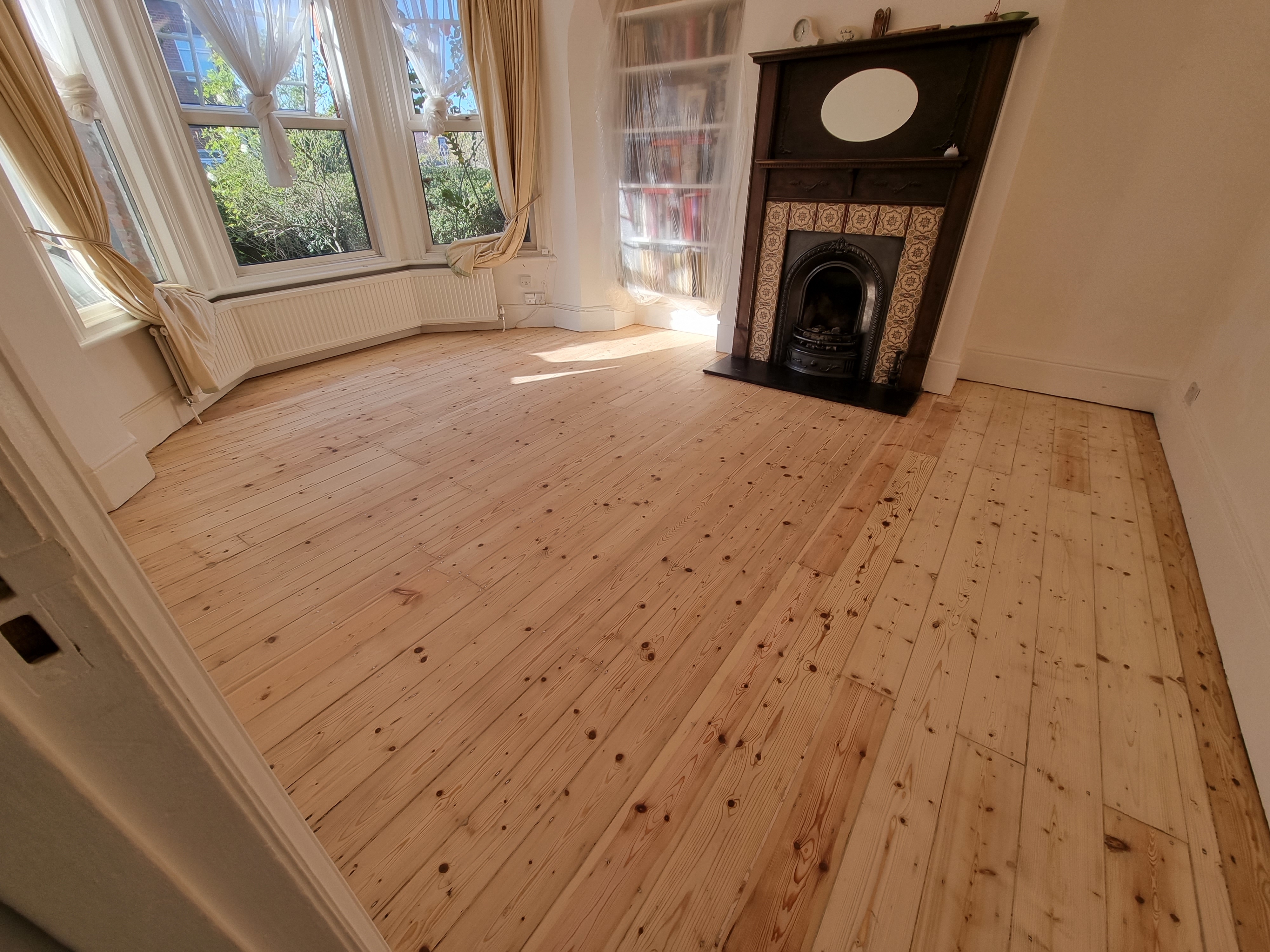 Floorboards floor after sanding work in NW10