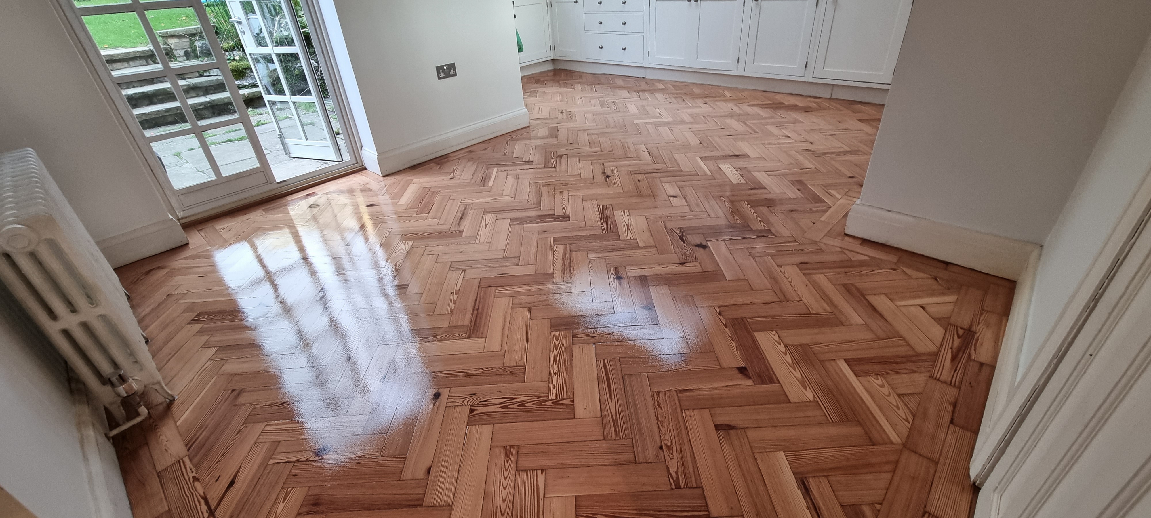 Parquet floor after sanding work in NW11