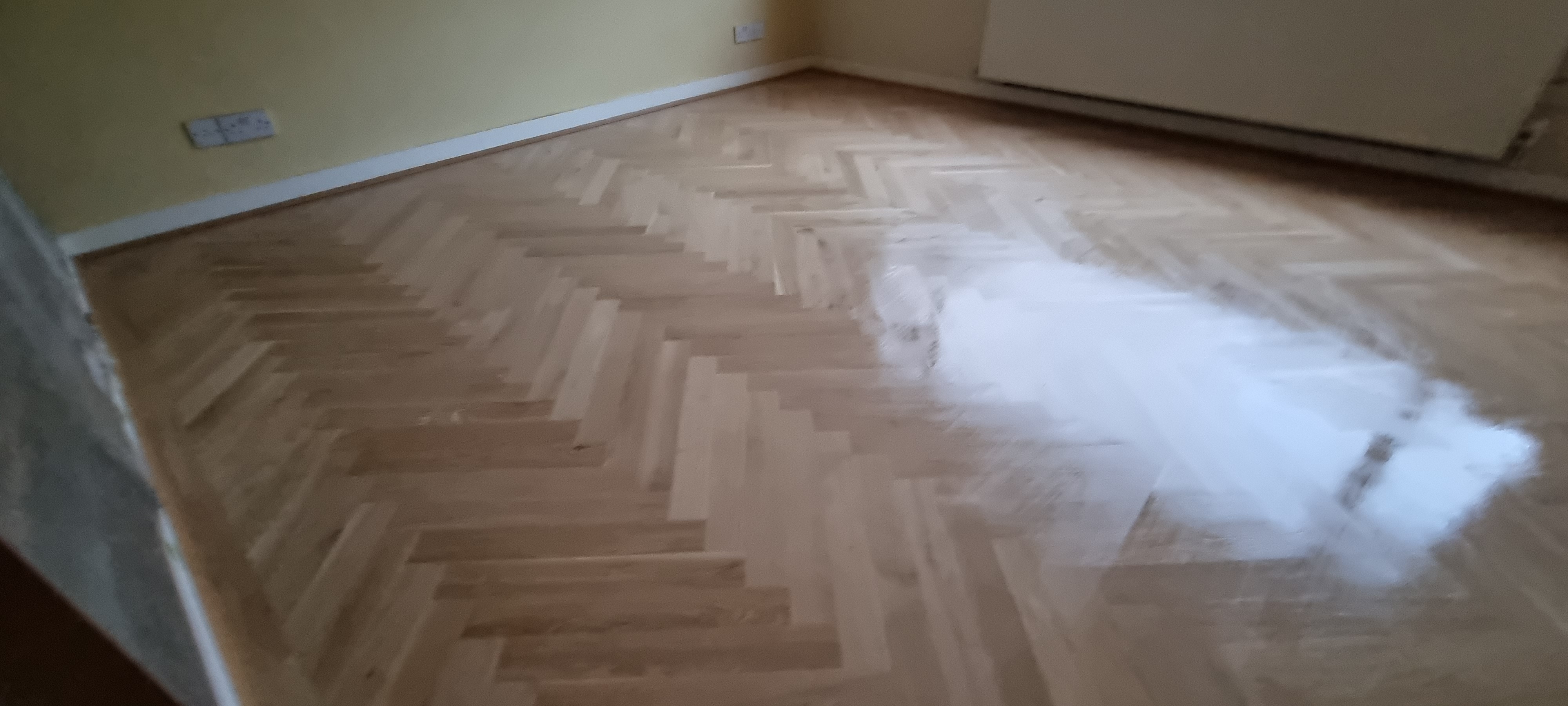 Parquet floor after sanding work in NW2