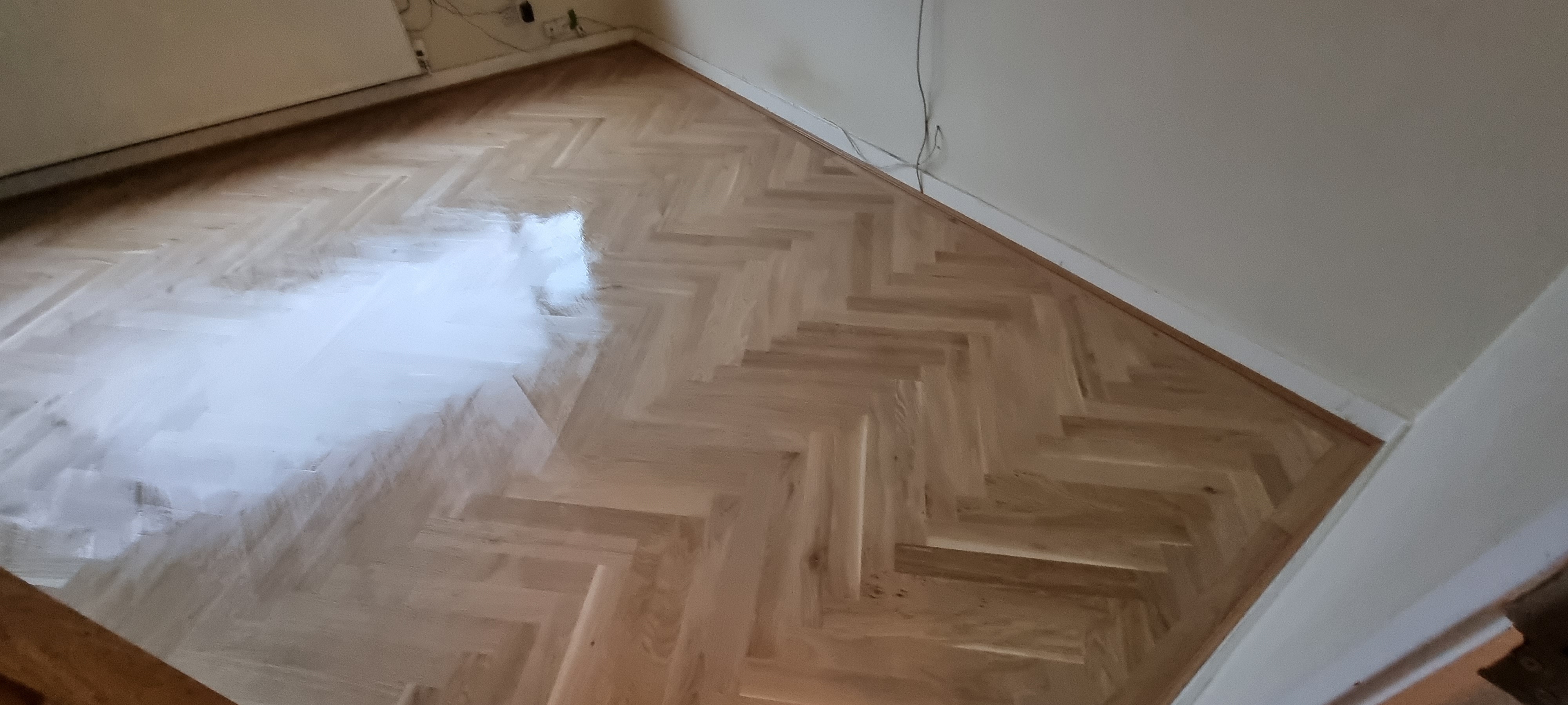 Parquet floor after sanding work in NW2