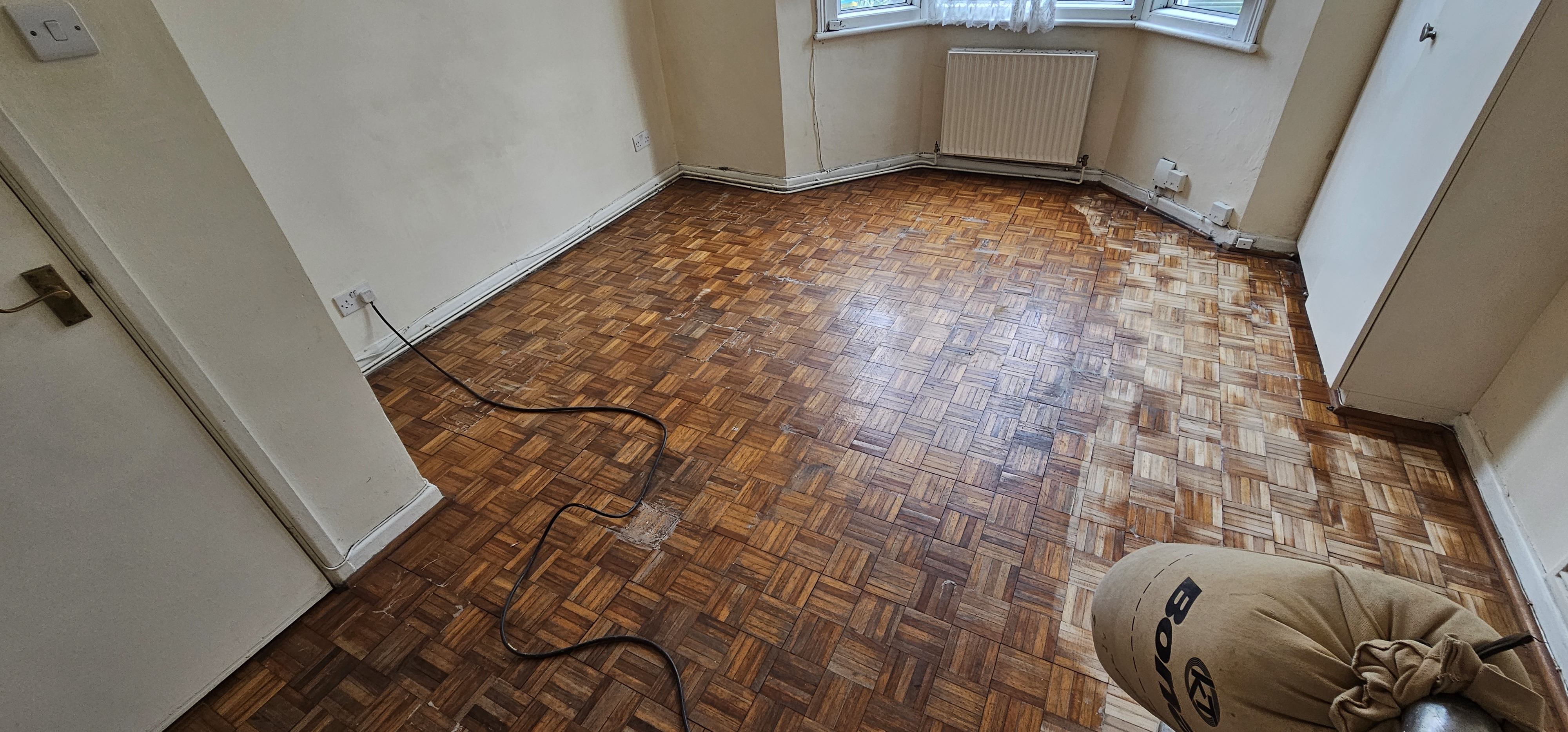 Parquet floor after sanding work in NW2