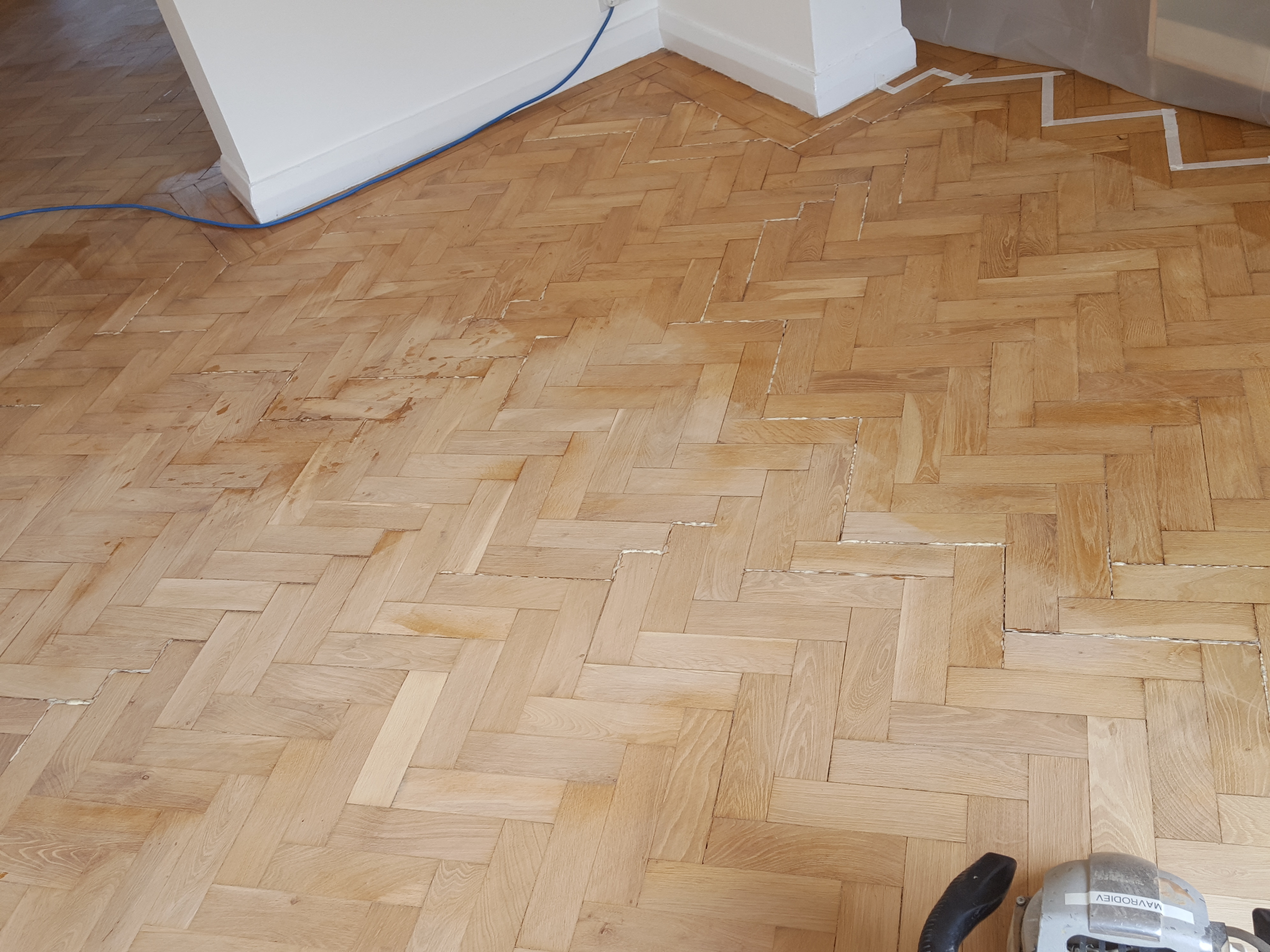 Parquet floor after sanding work in NW4