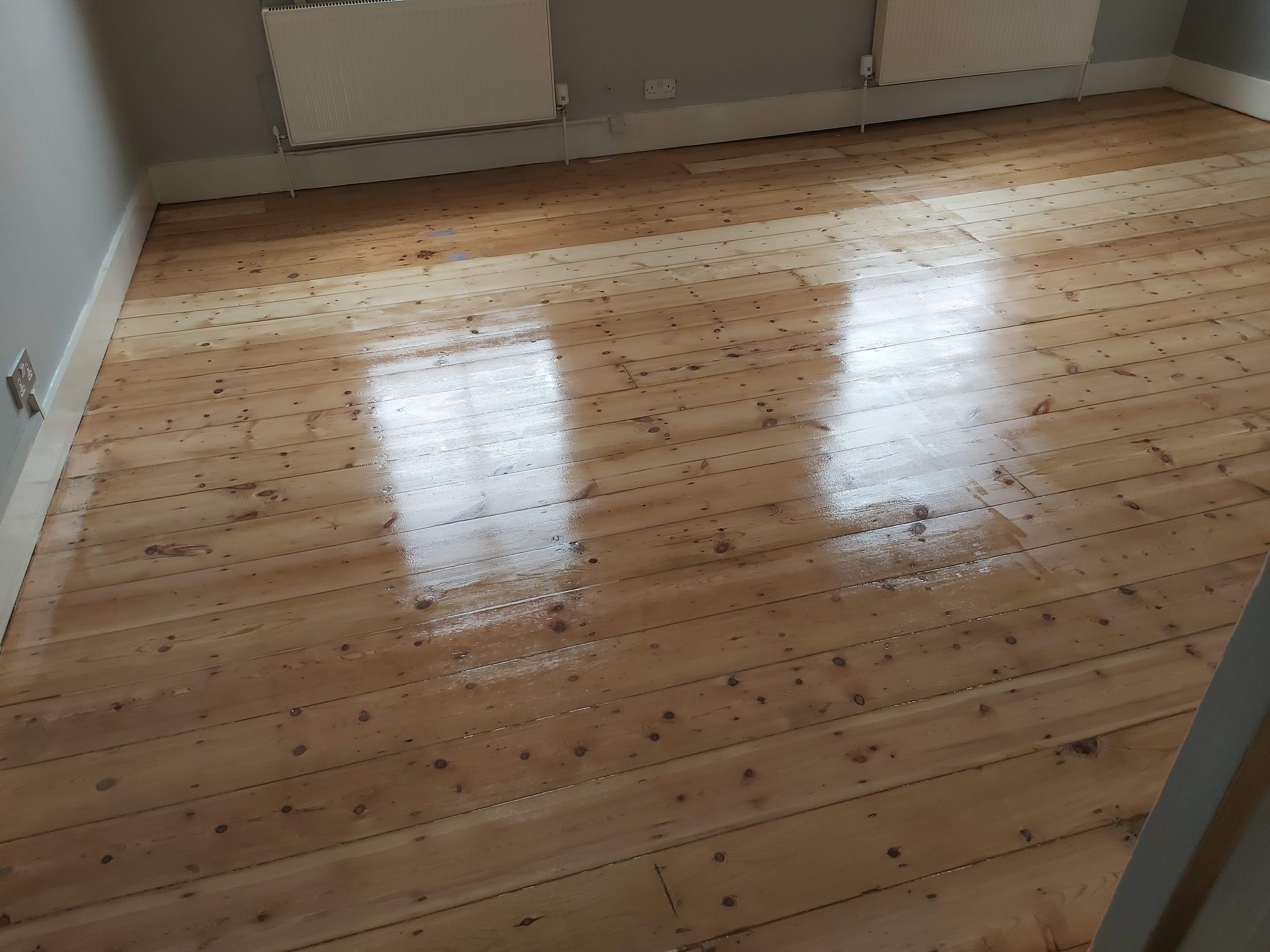 Floorboards floor after sanding work in NW5