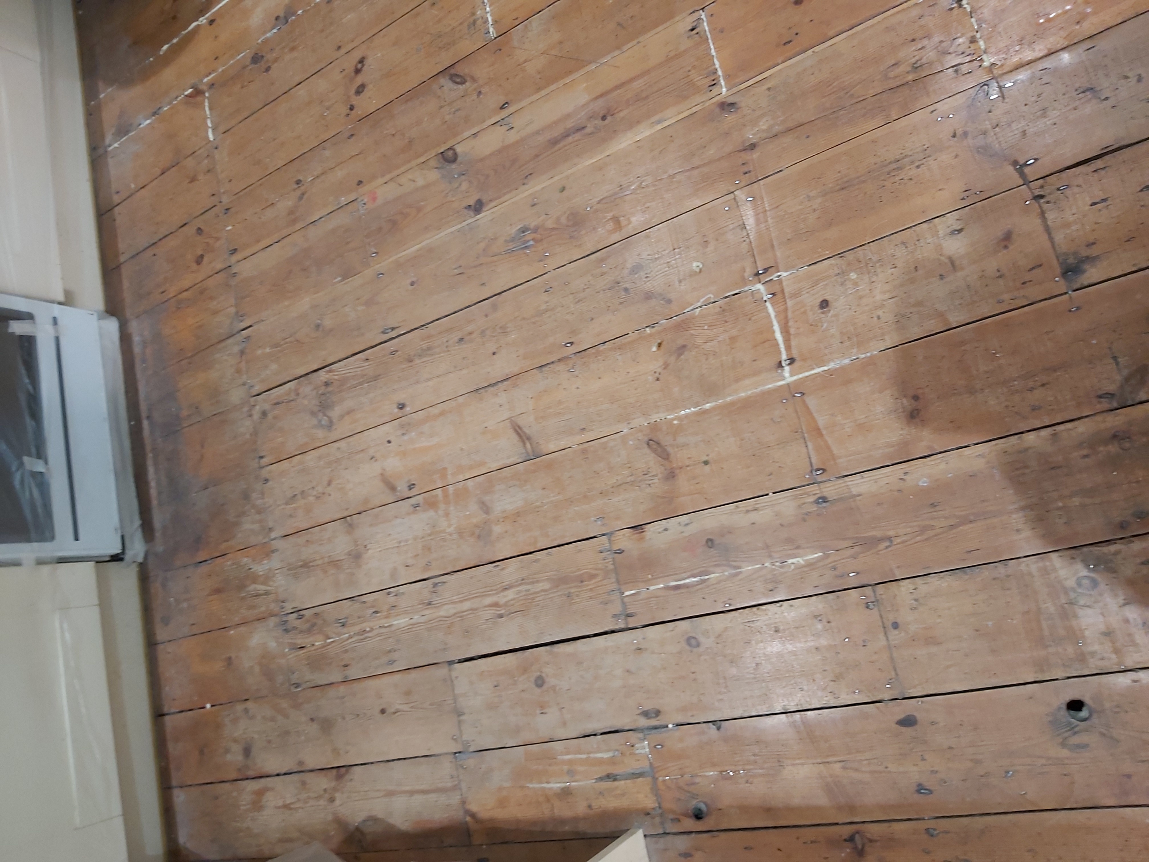 Floorboards floor after sanding work in NW6