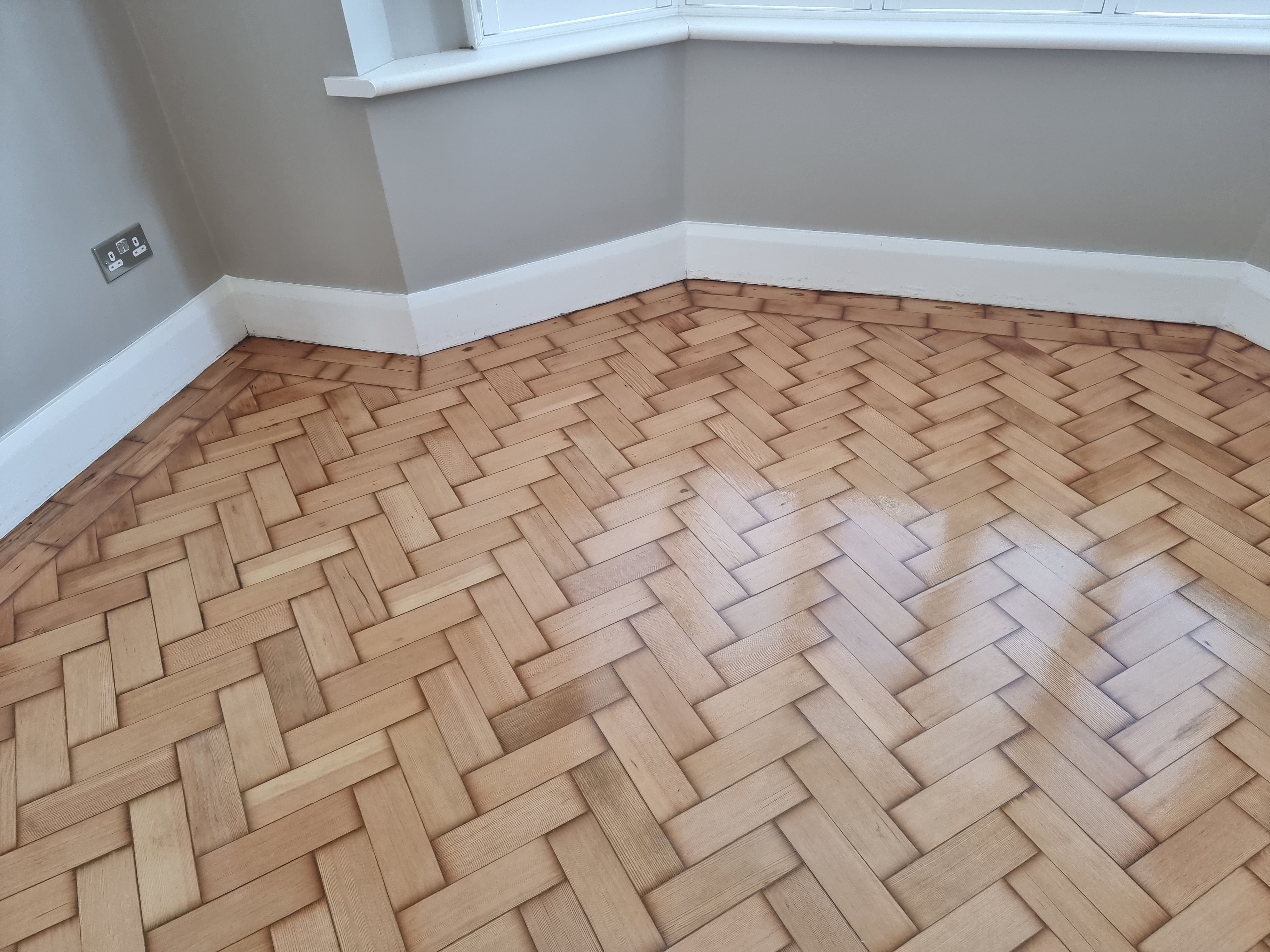 Parquet floor after sanding work in RM2