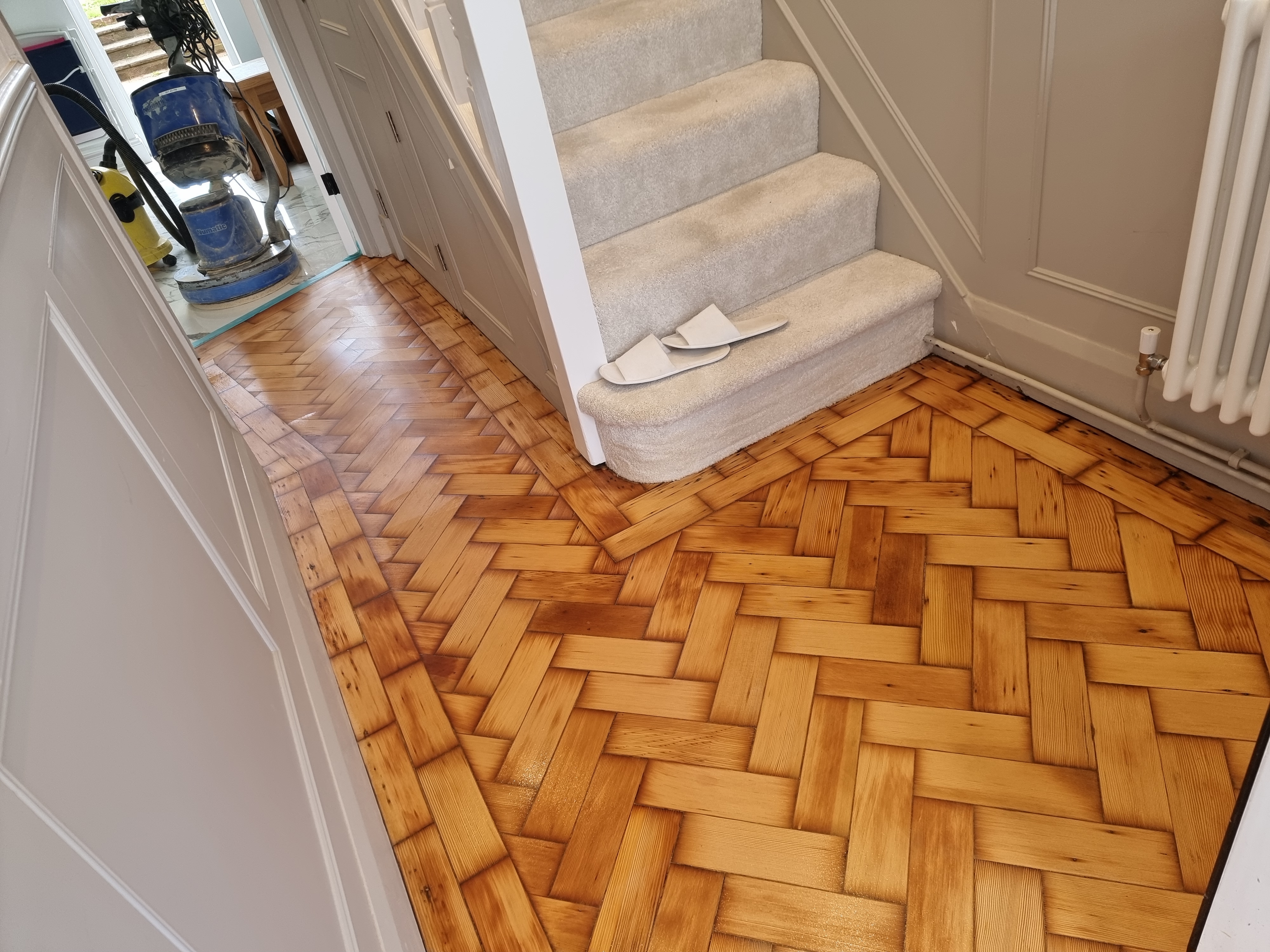 Parquet floor after sanding work in RM2