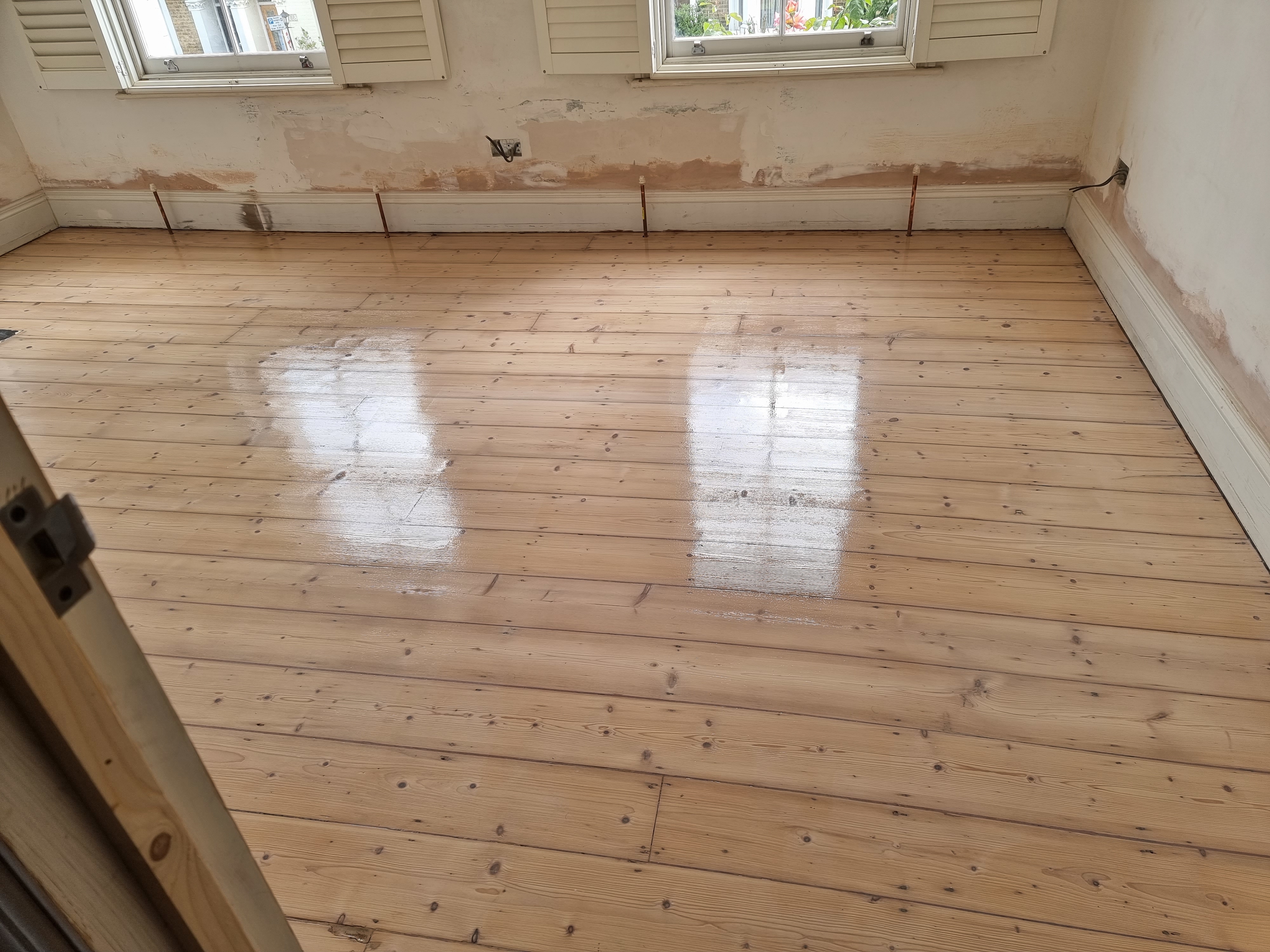 Floorboards floor after sanding work in SE10