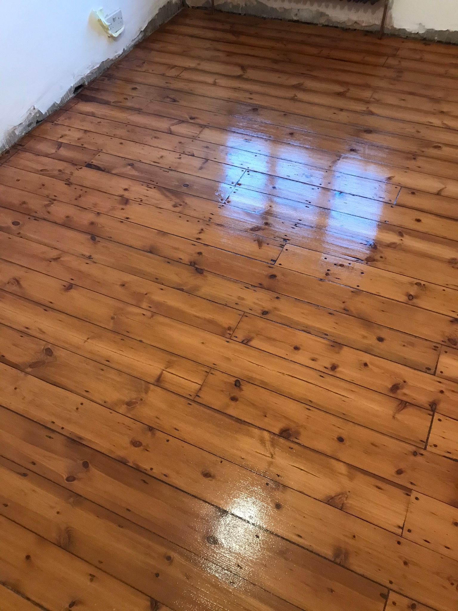Floorboards floor after sanding work in SE9