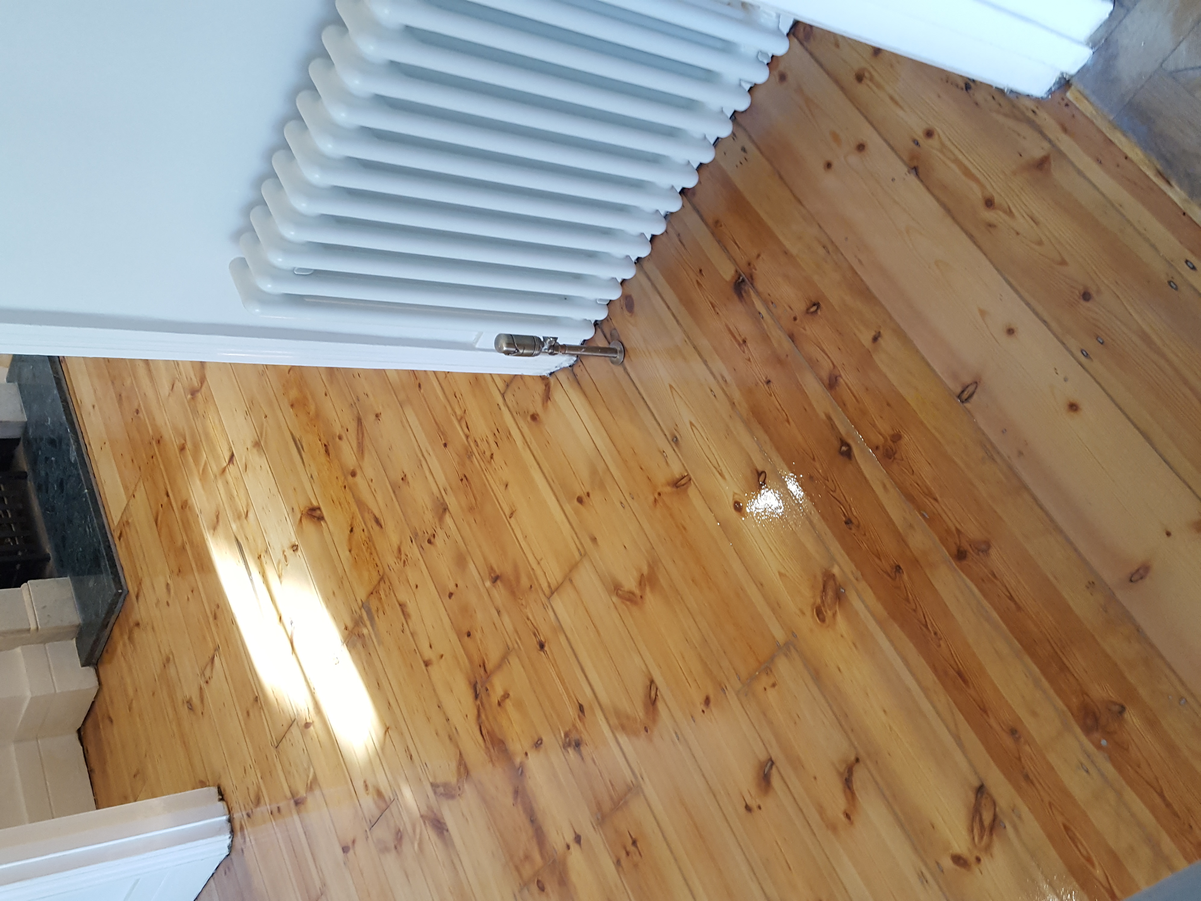 Floorboards floor after sanding work in SW11