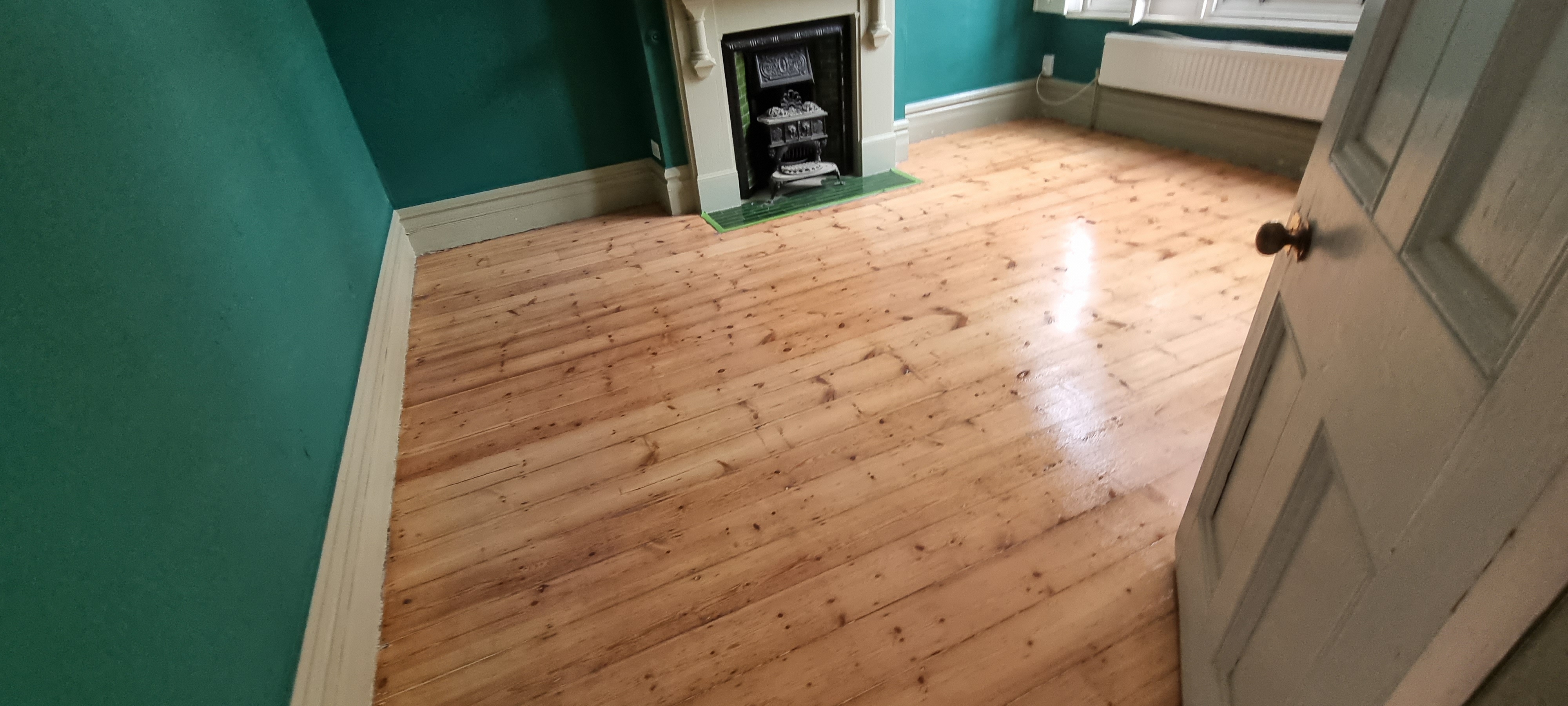 Floorboards floor after sanding work in SW12
