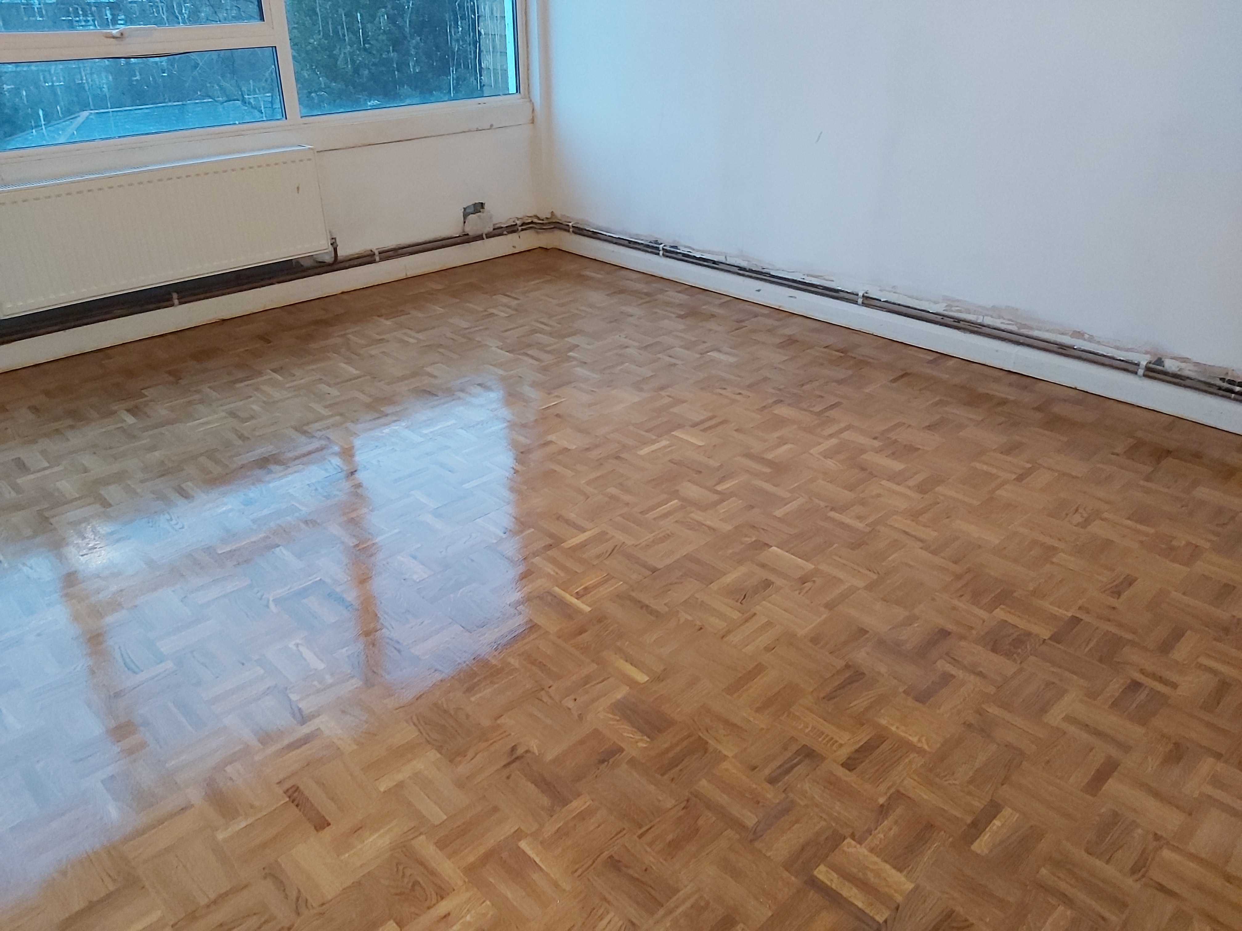 Hardwood floor after sanding work in SW15