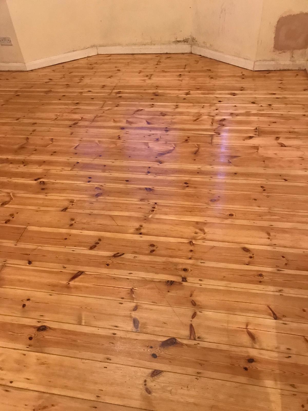 Floorboards floor after sanding work in SW16