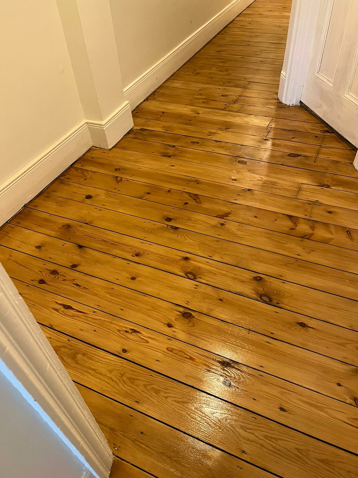 Floorboards floor after sanding work in SW16