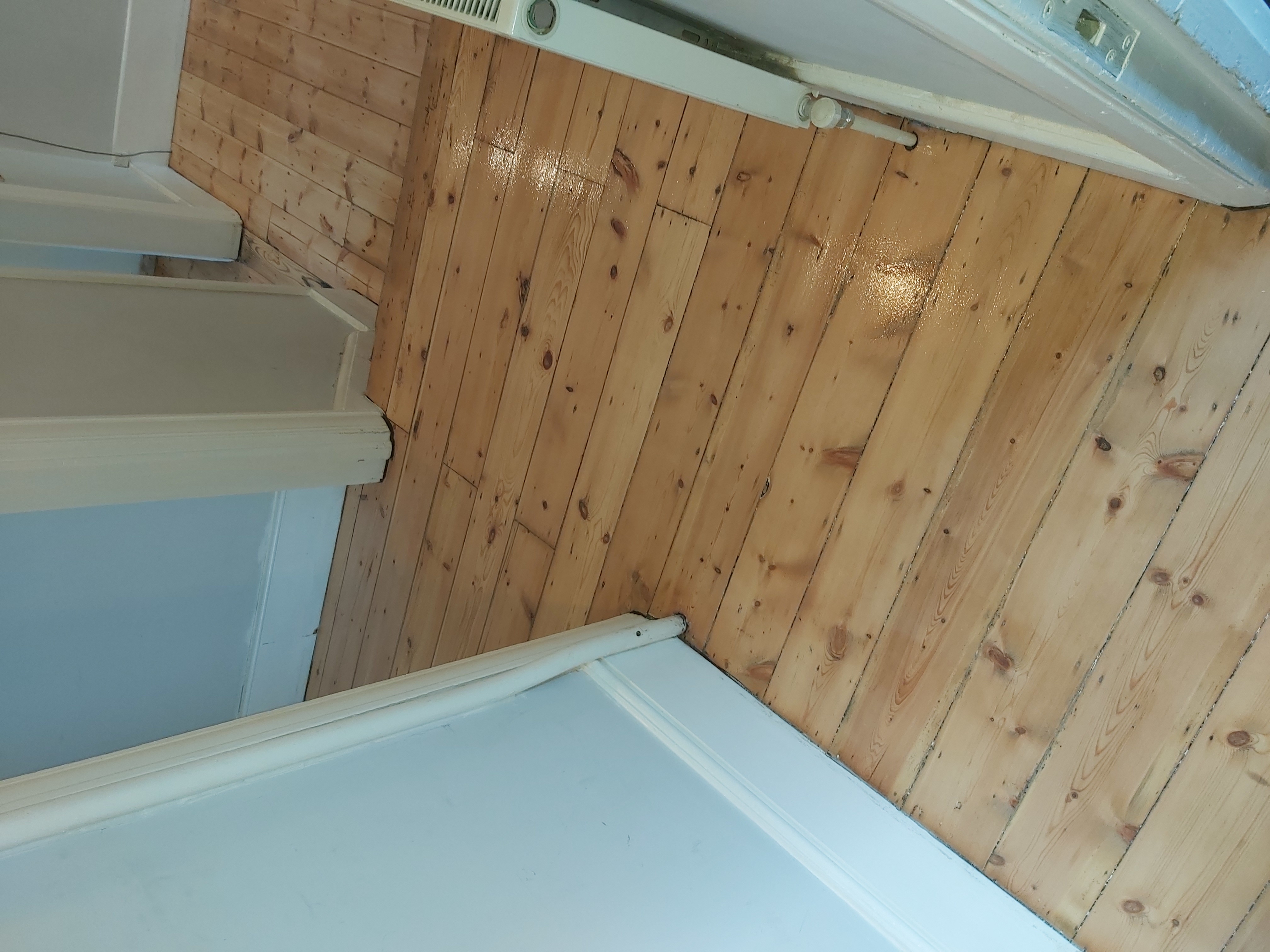 Floorboards floor after sanding work in SW16