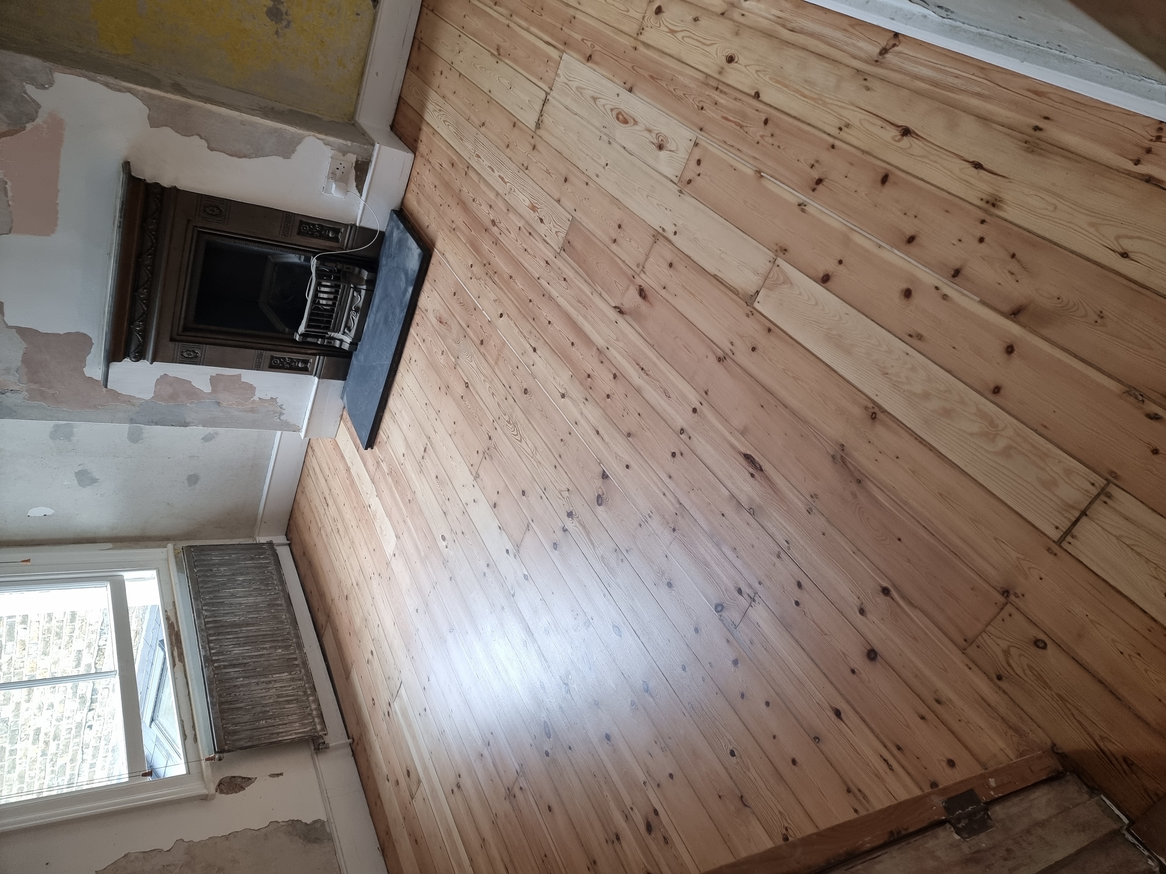 Floorboards floor after sanding work in SW18
