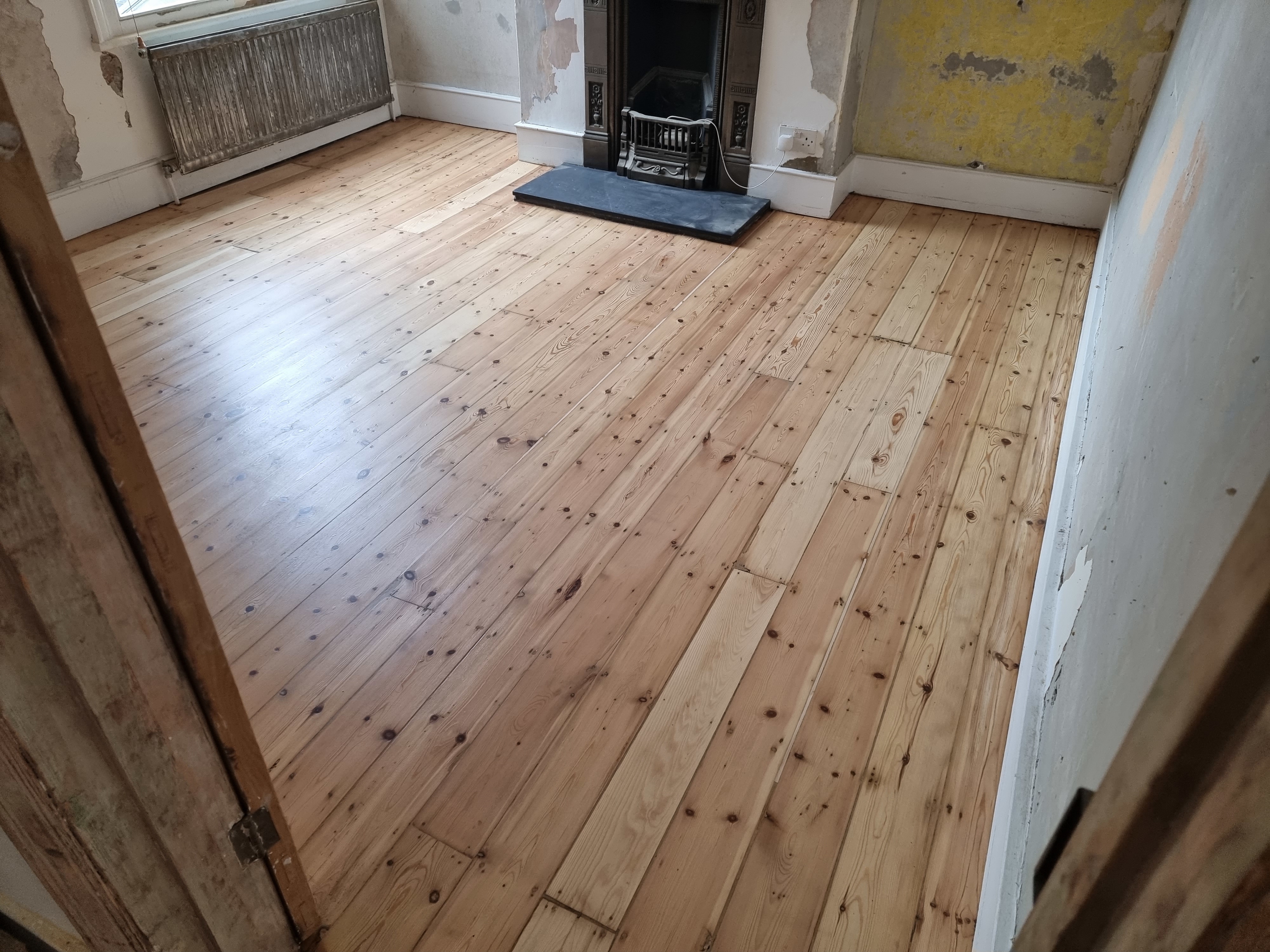 Floorboards floor after sanding work in SW18