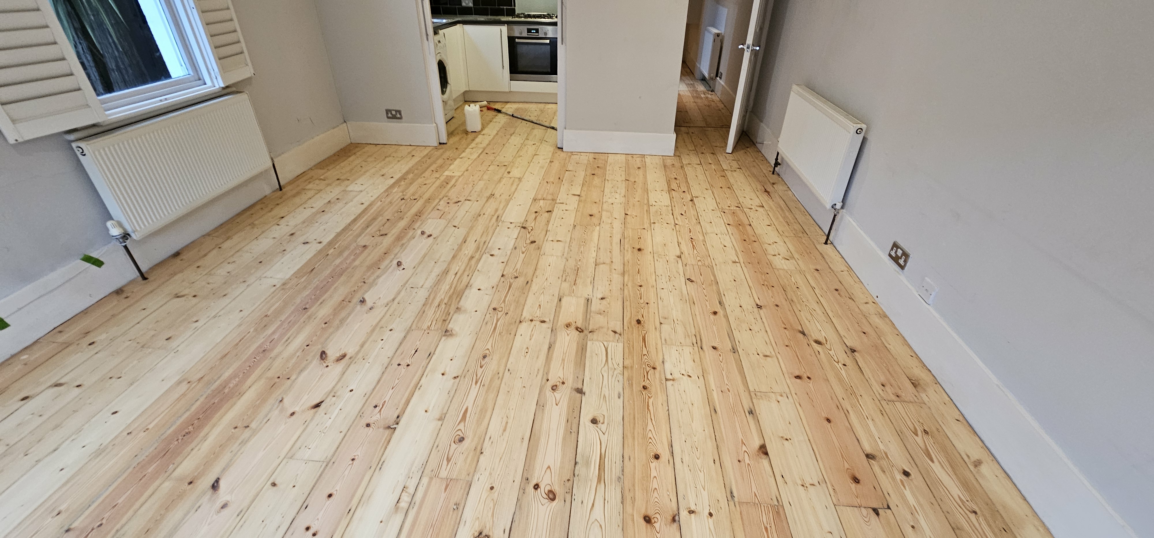 Floorboards floor after sanding work in SW6