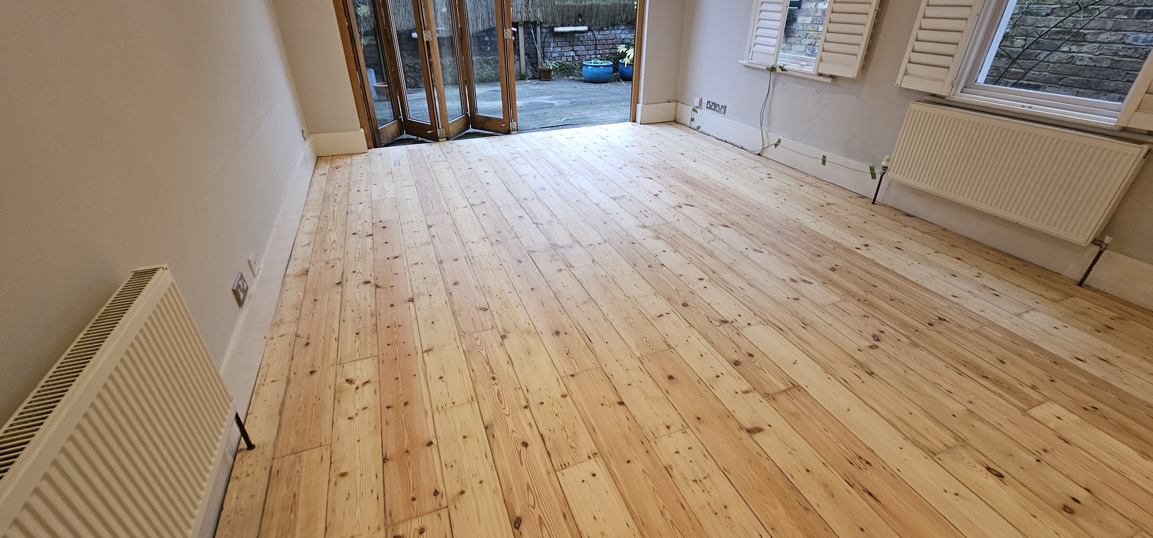 Floorboards floor after sanding work in SW6