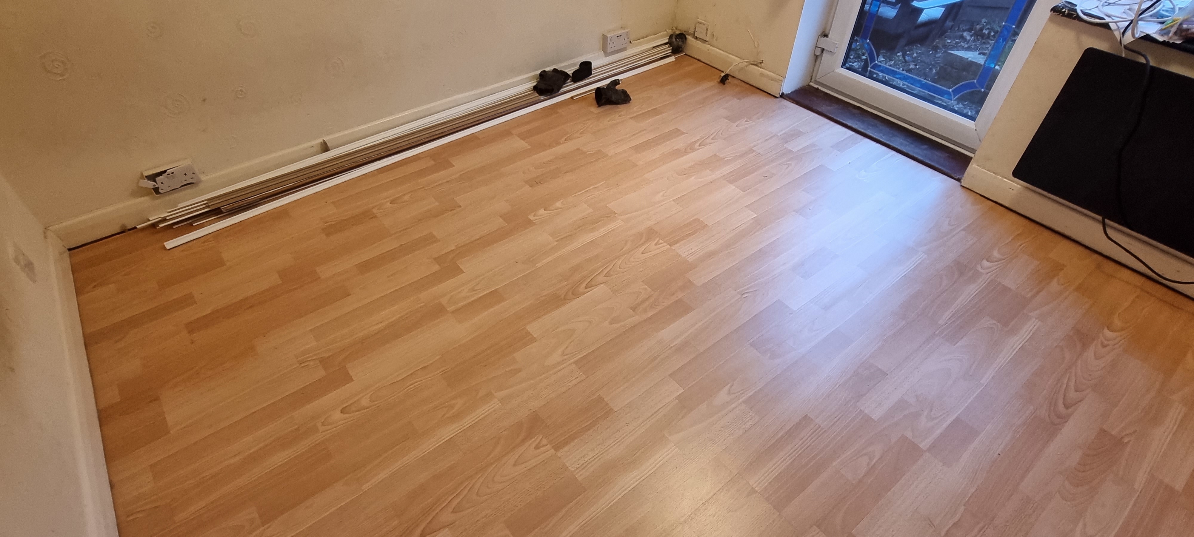 Laminate floor after fitting work in UB7