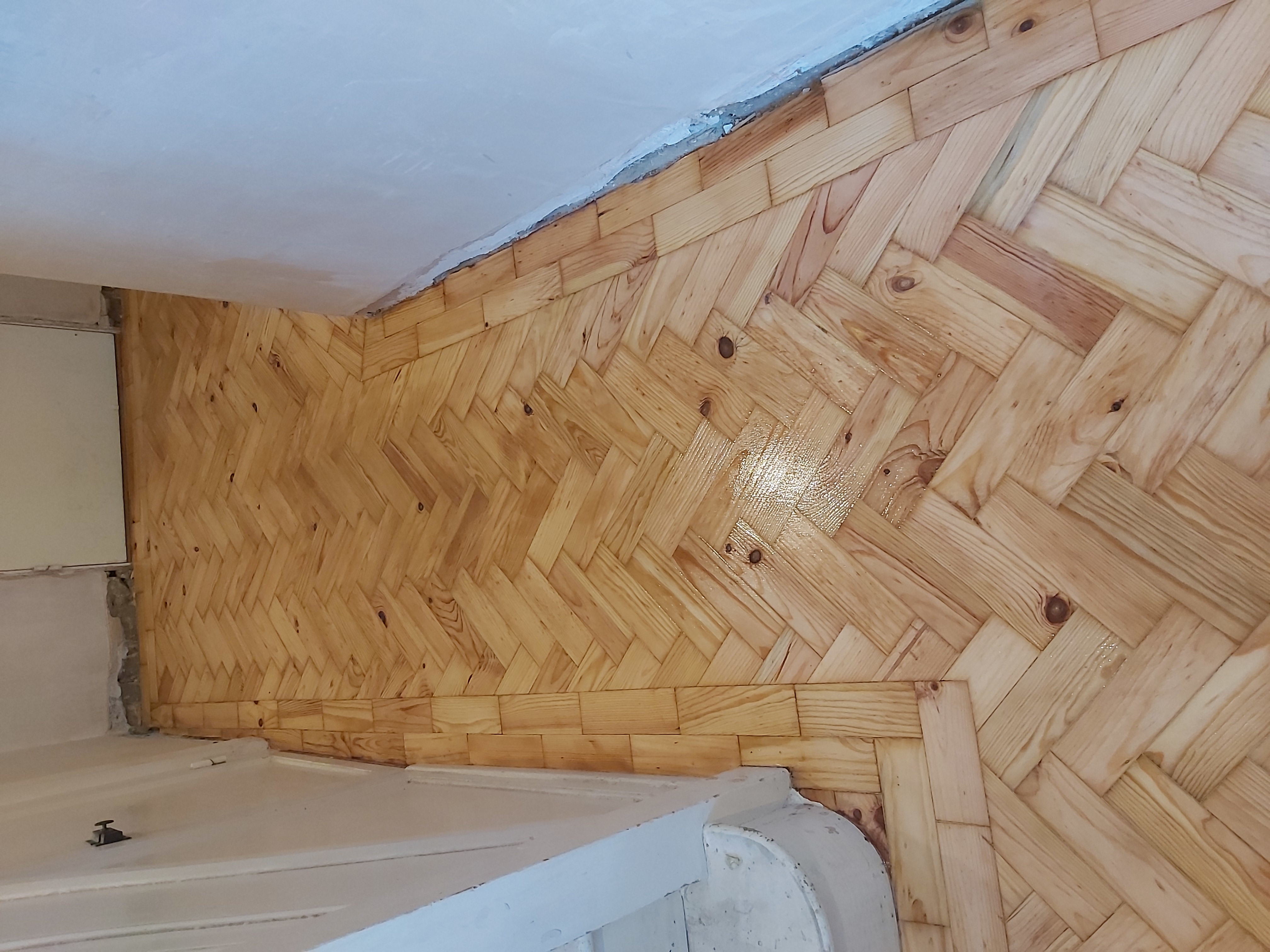 Parquet floor after sanding work in UB7