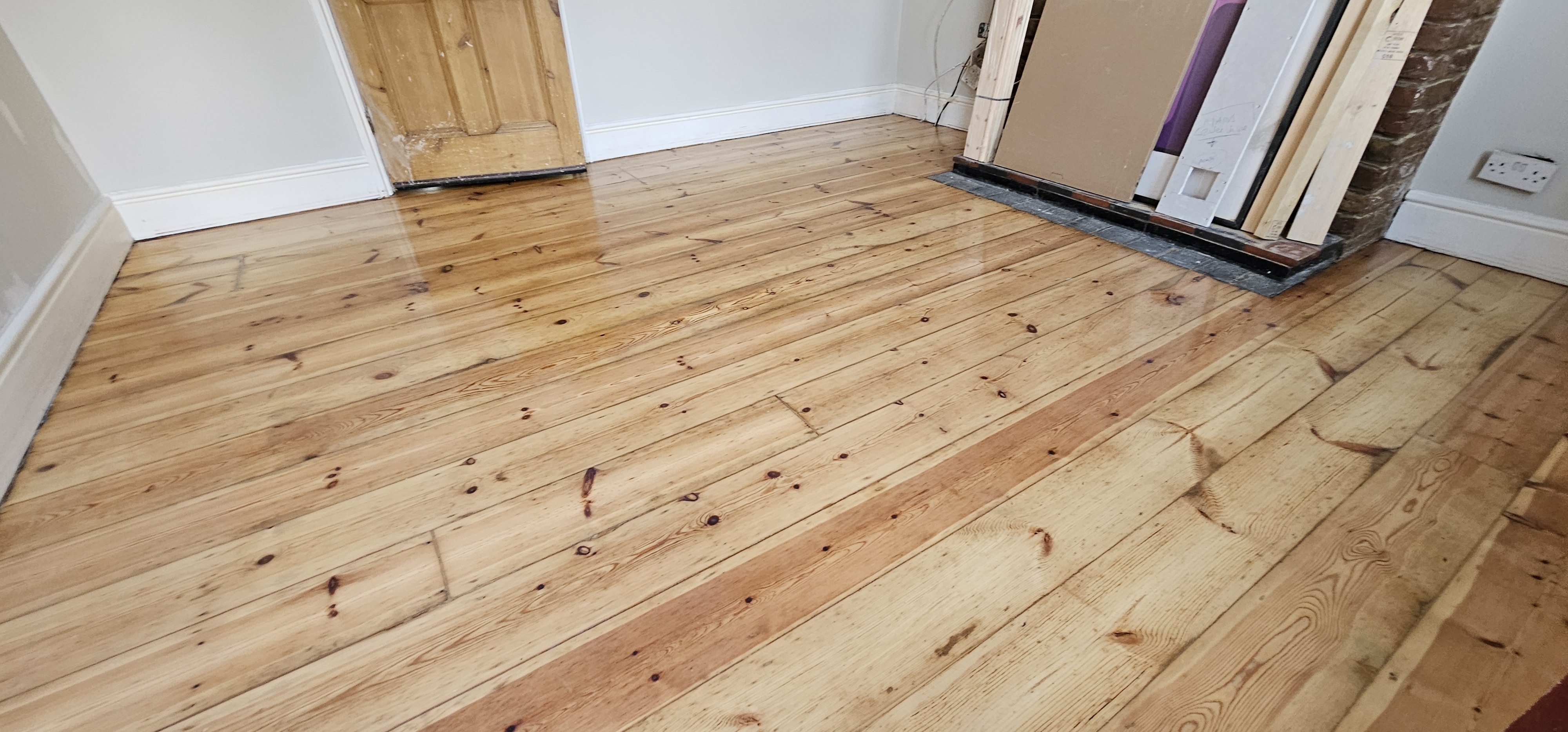 Floorboards floor after sanding work in UB8