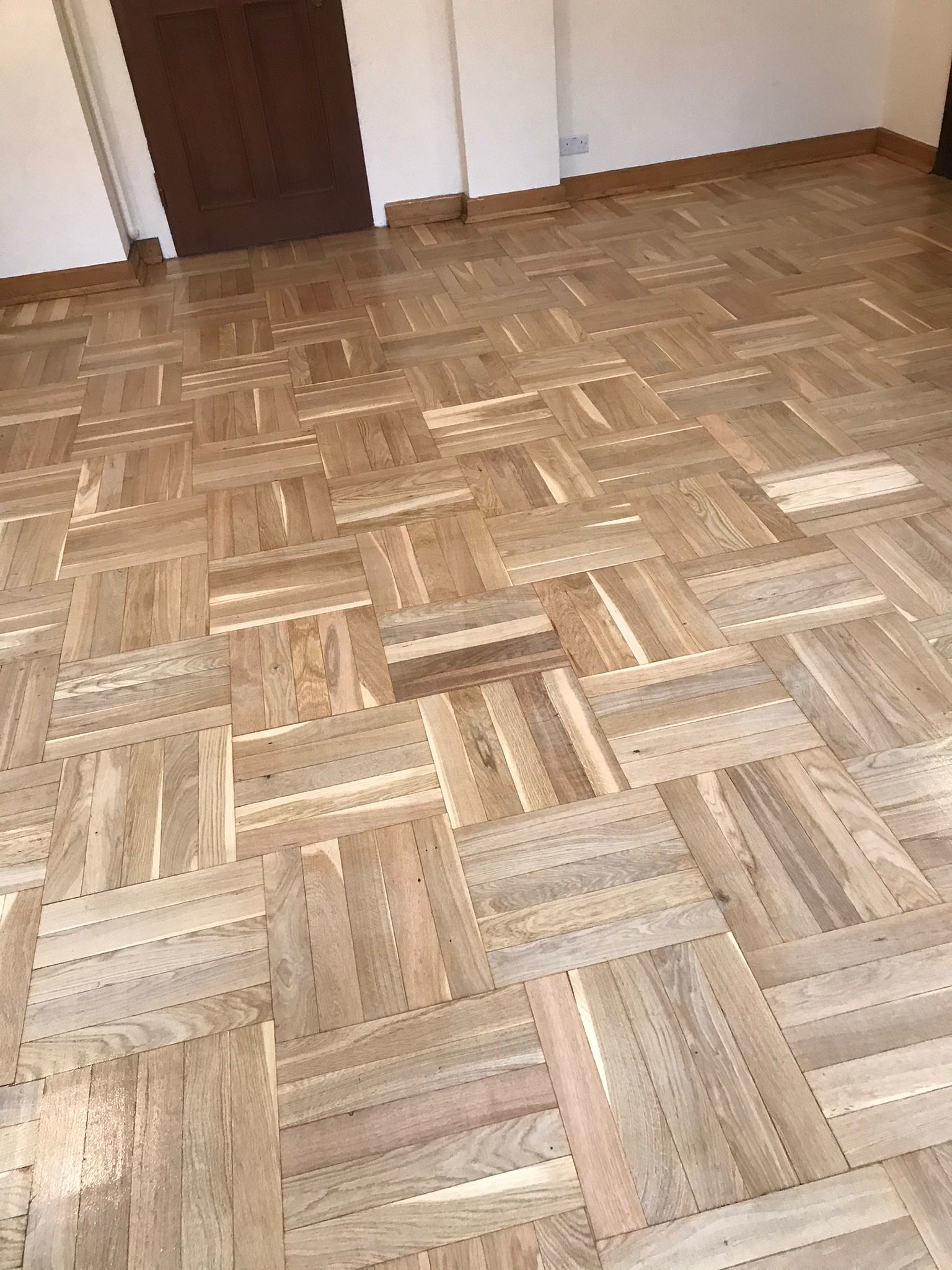 Hardwood floor after sanding work in W1B
