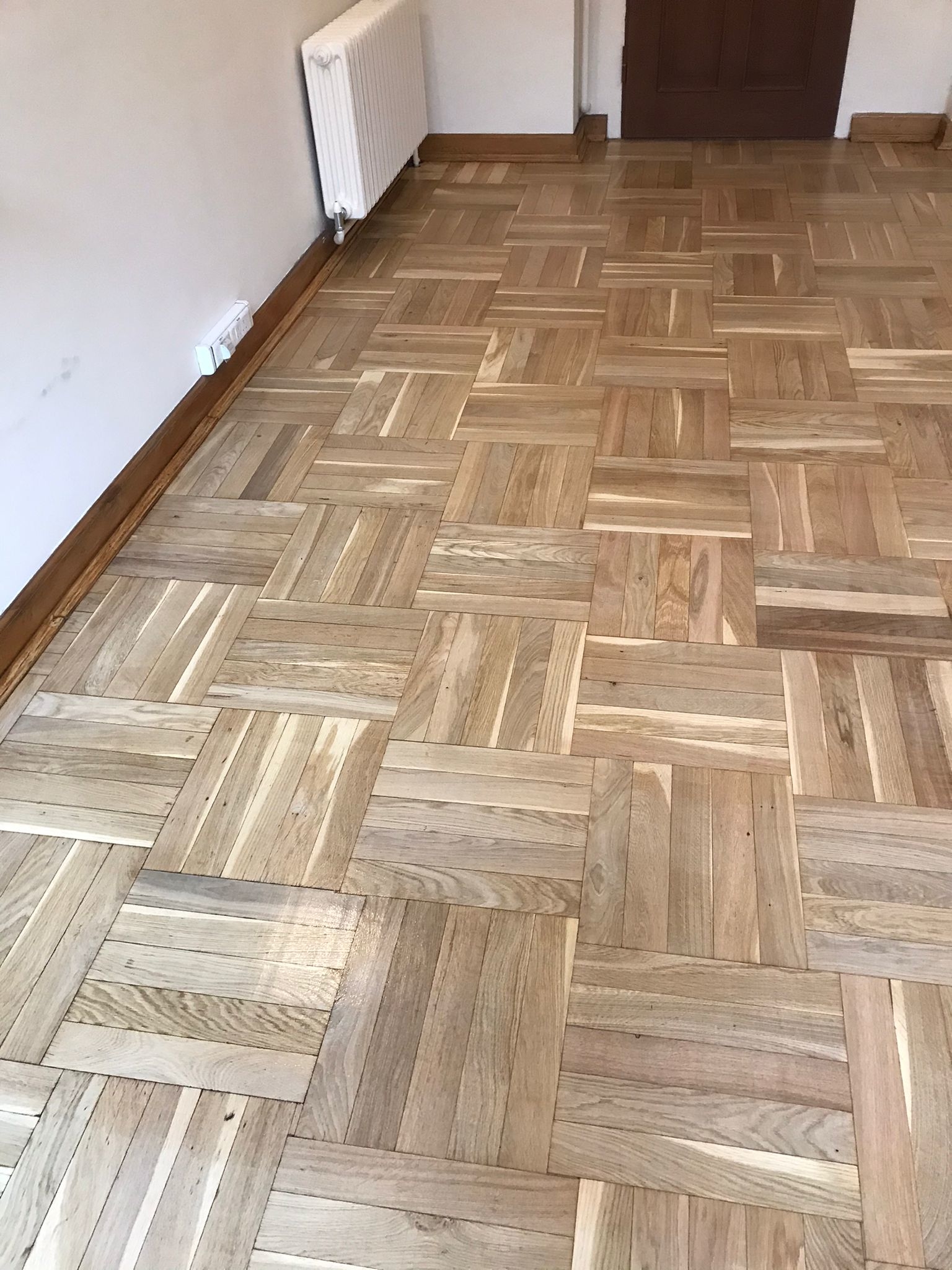 Hardwood floor after sanding work in W1B