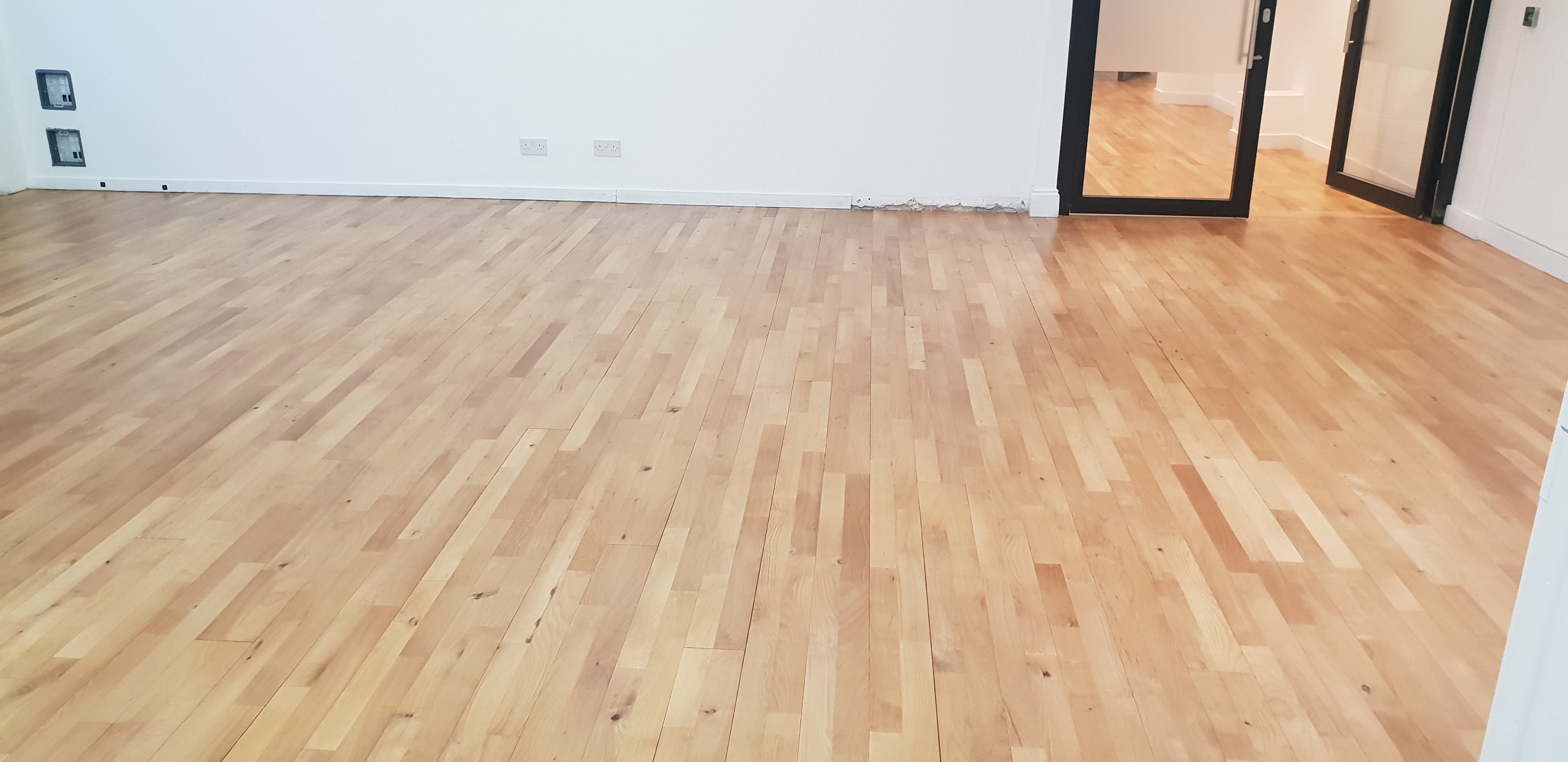 Hardwood floor after sanding work in W1S