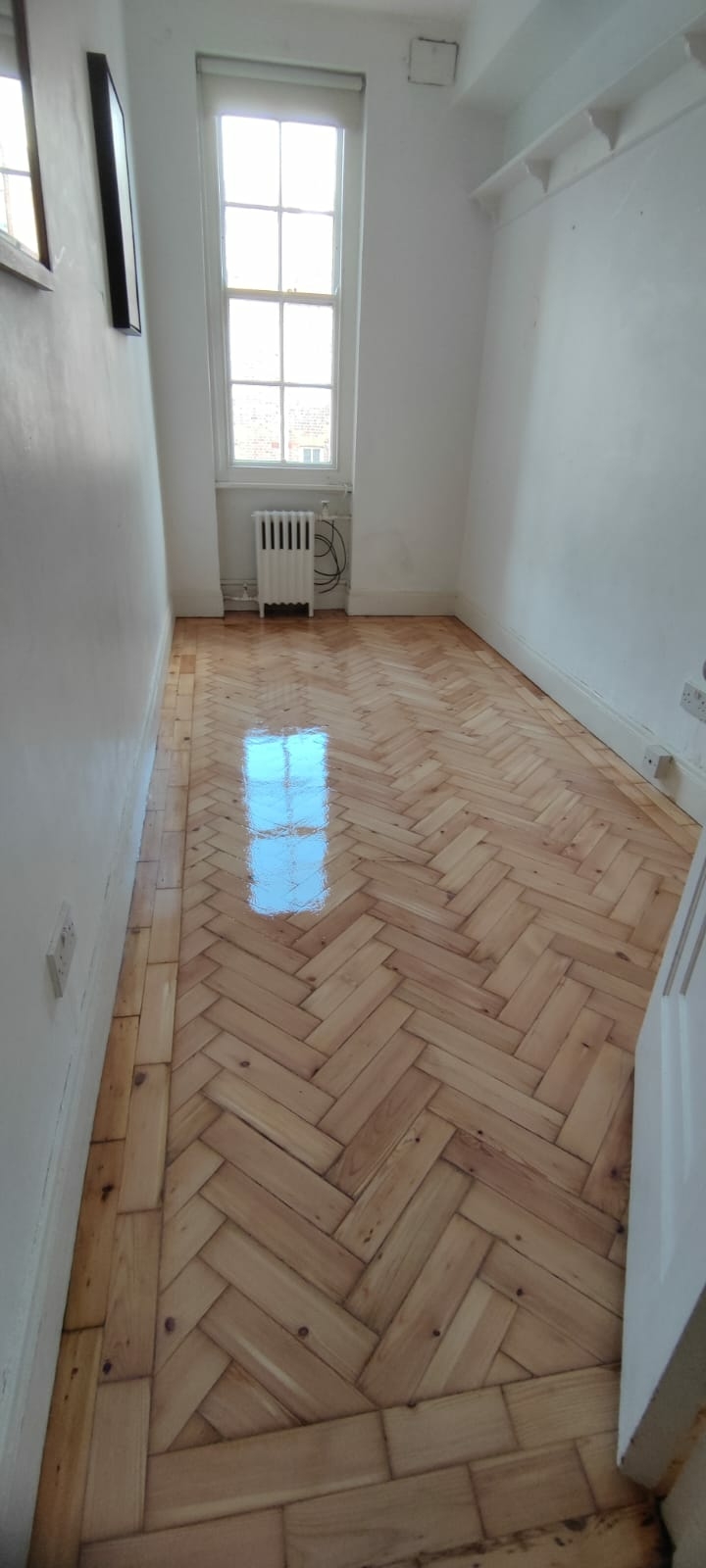 Parquet floor after sanding work in W2