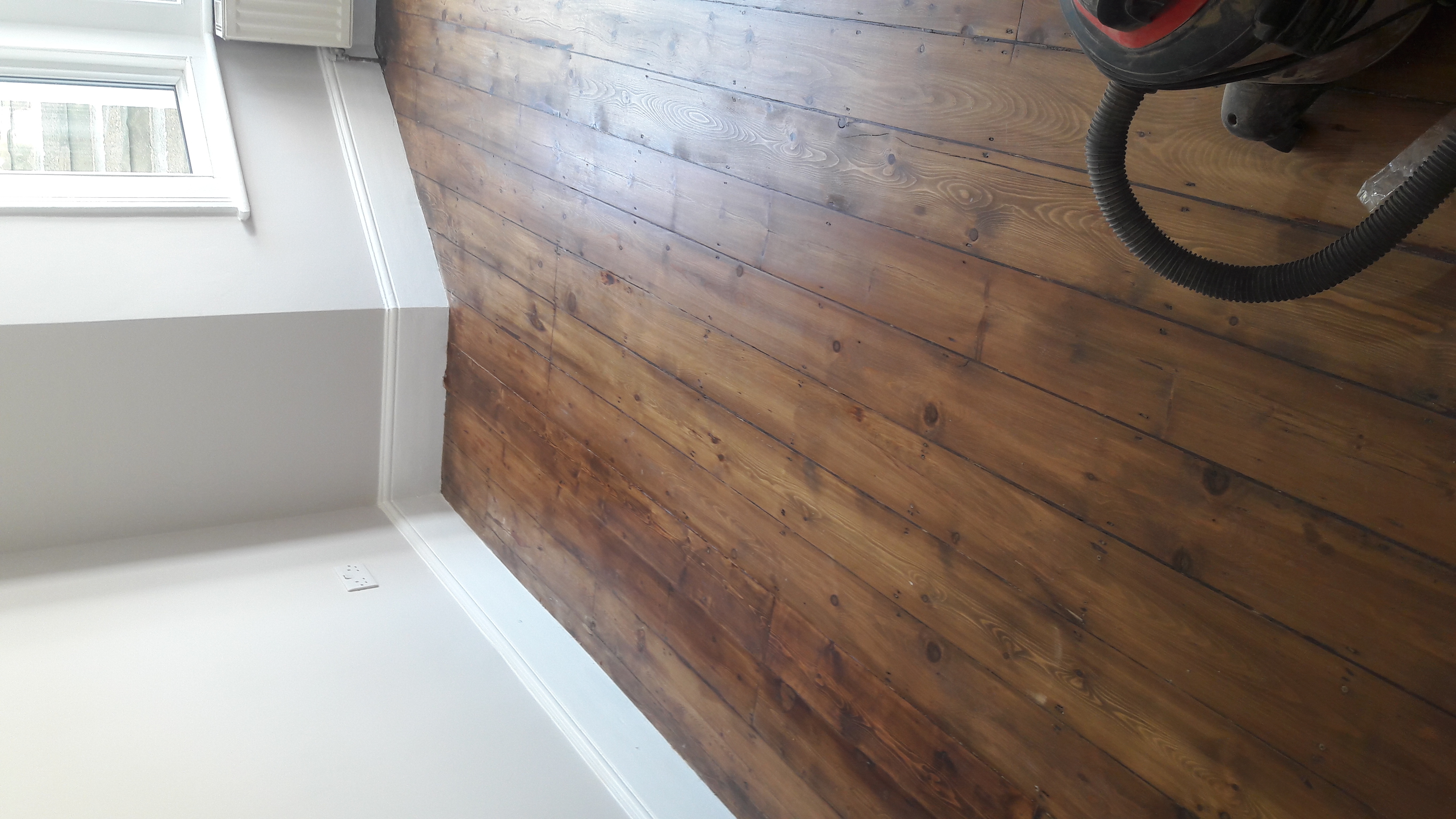 Floorboards floor after fitting work in W5