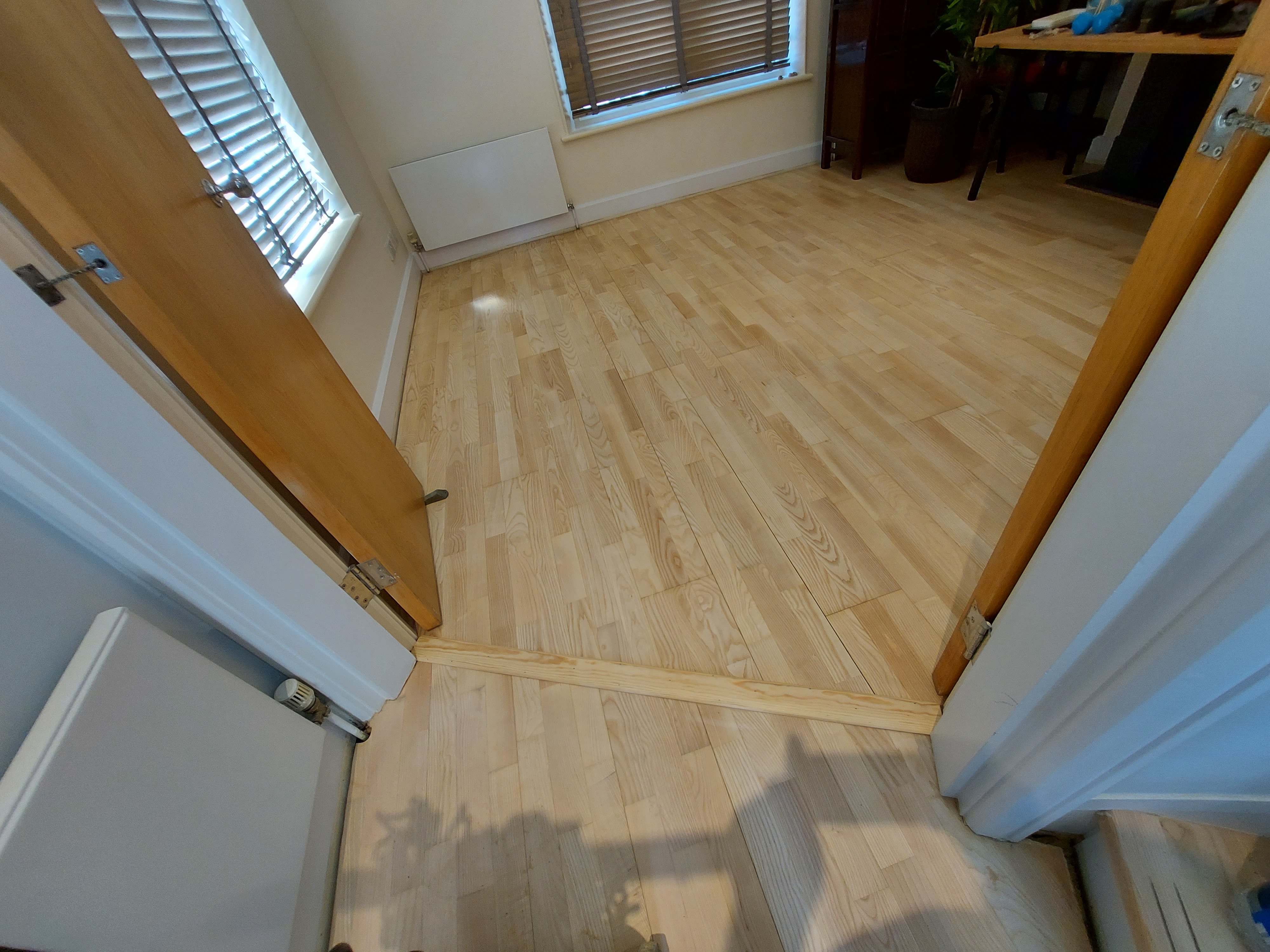 Hardwood floor after sanding work in W8